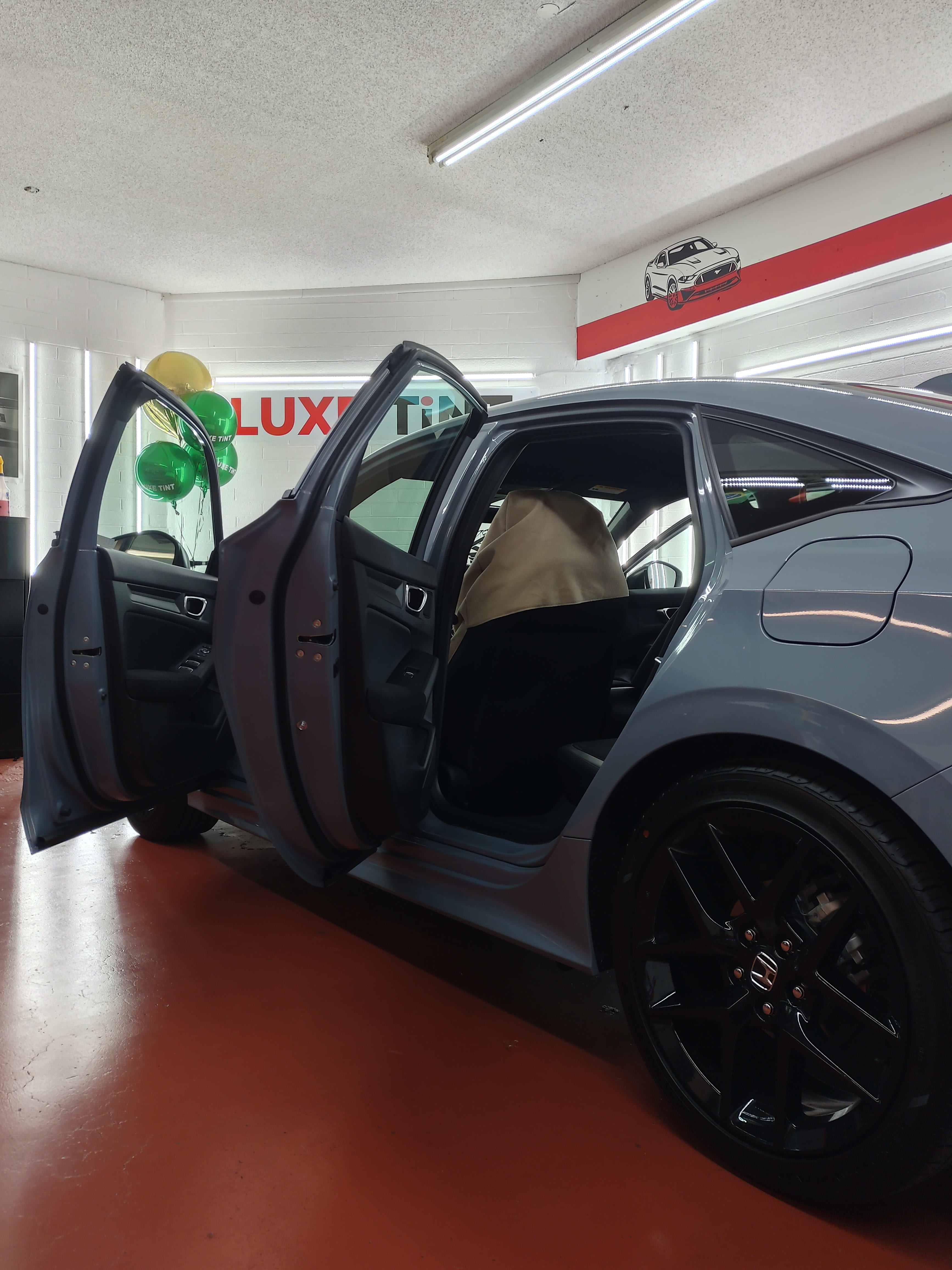 Grey Honda Civic, doors open