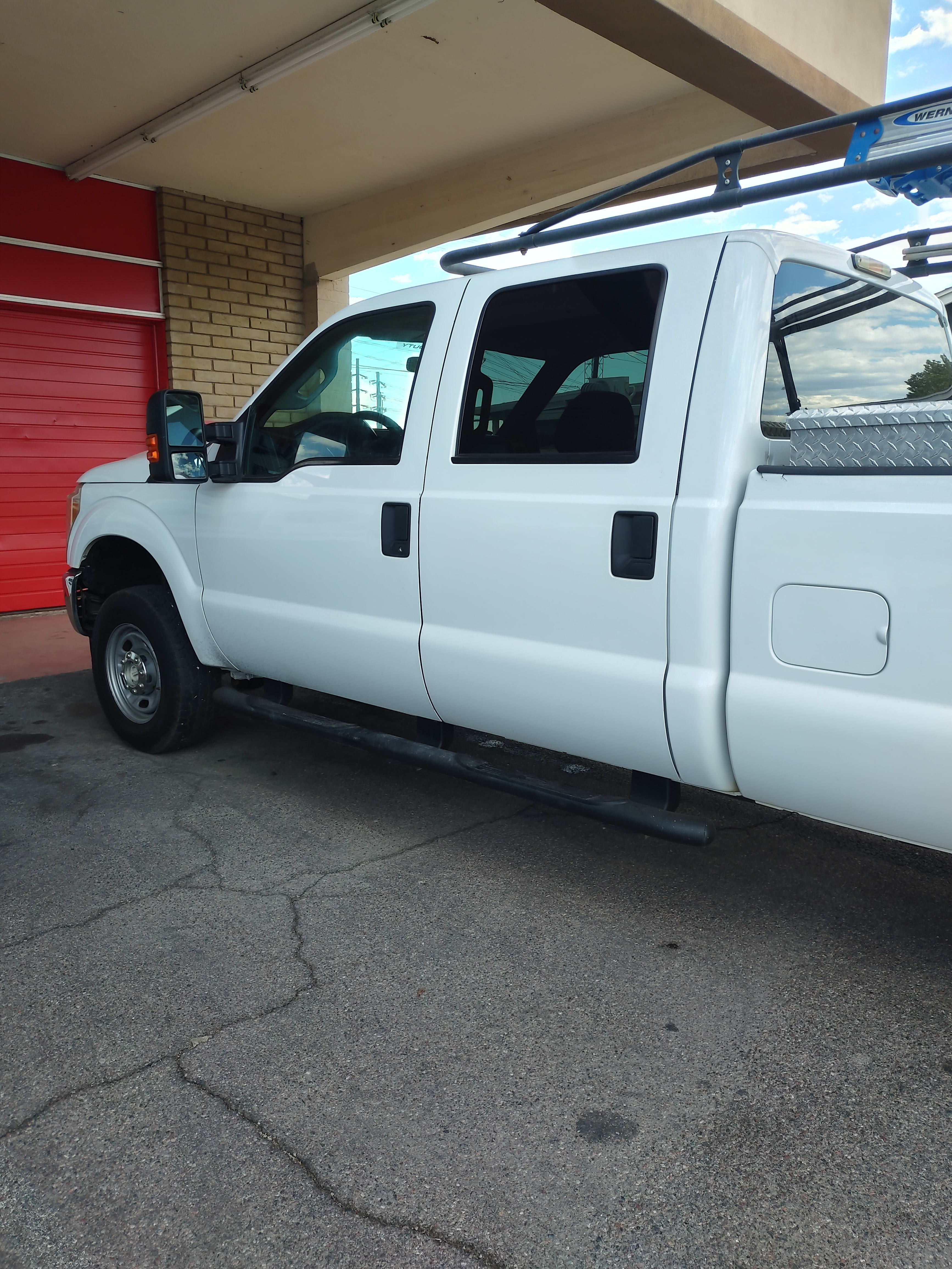 White Ford F-250 crew cab, side