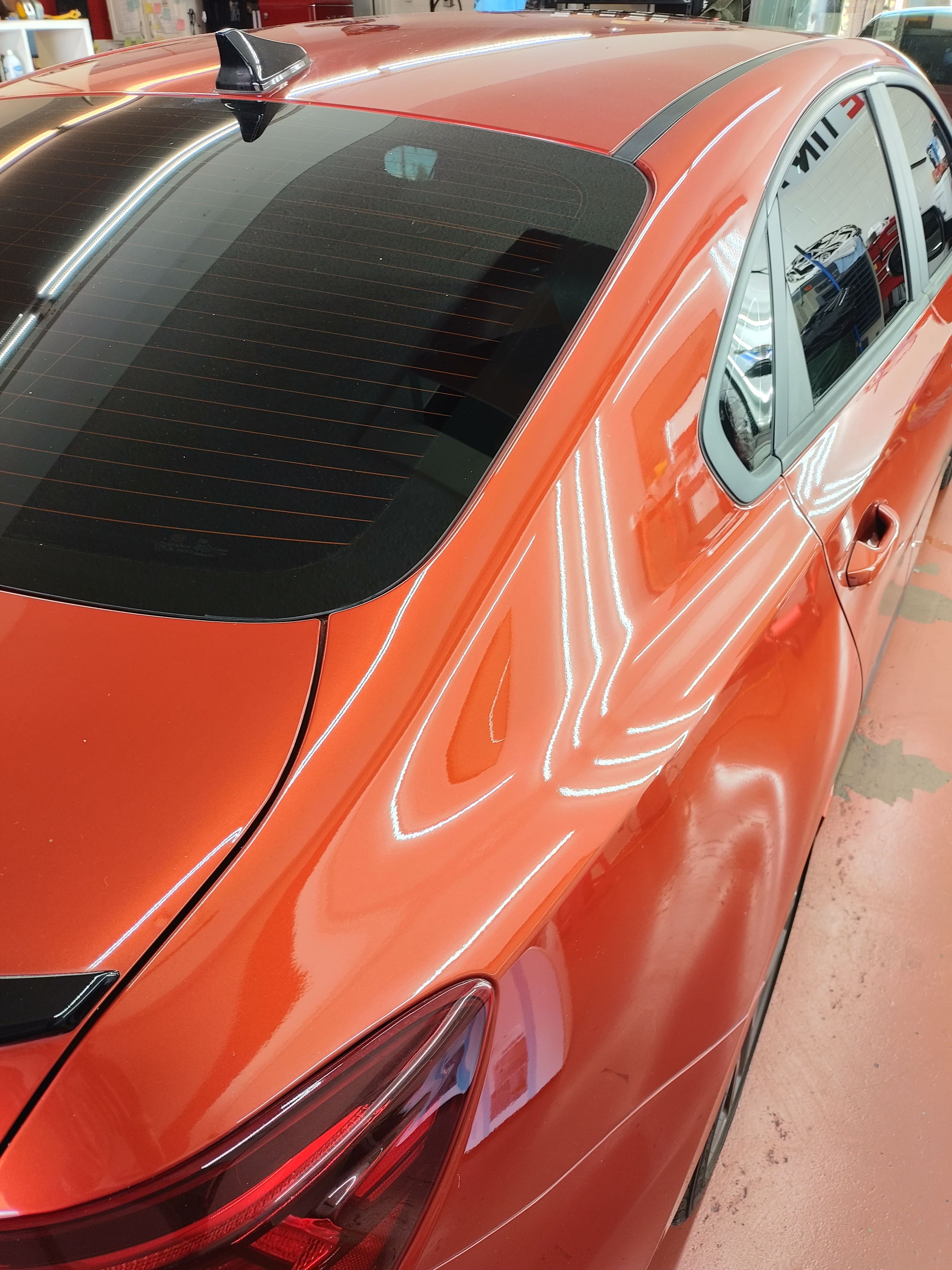 Orange Hyundai Elantra, rear glass