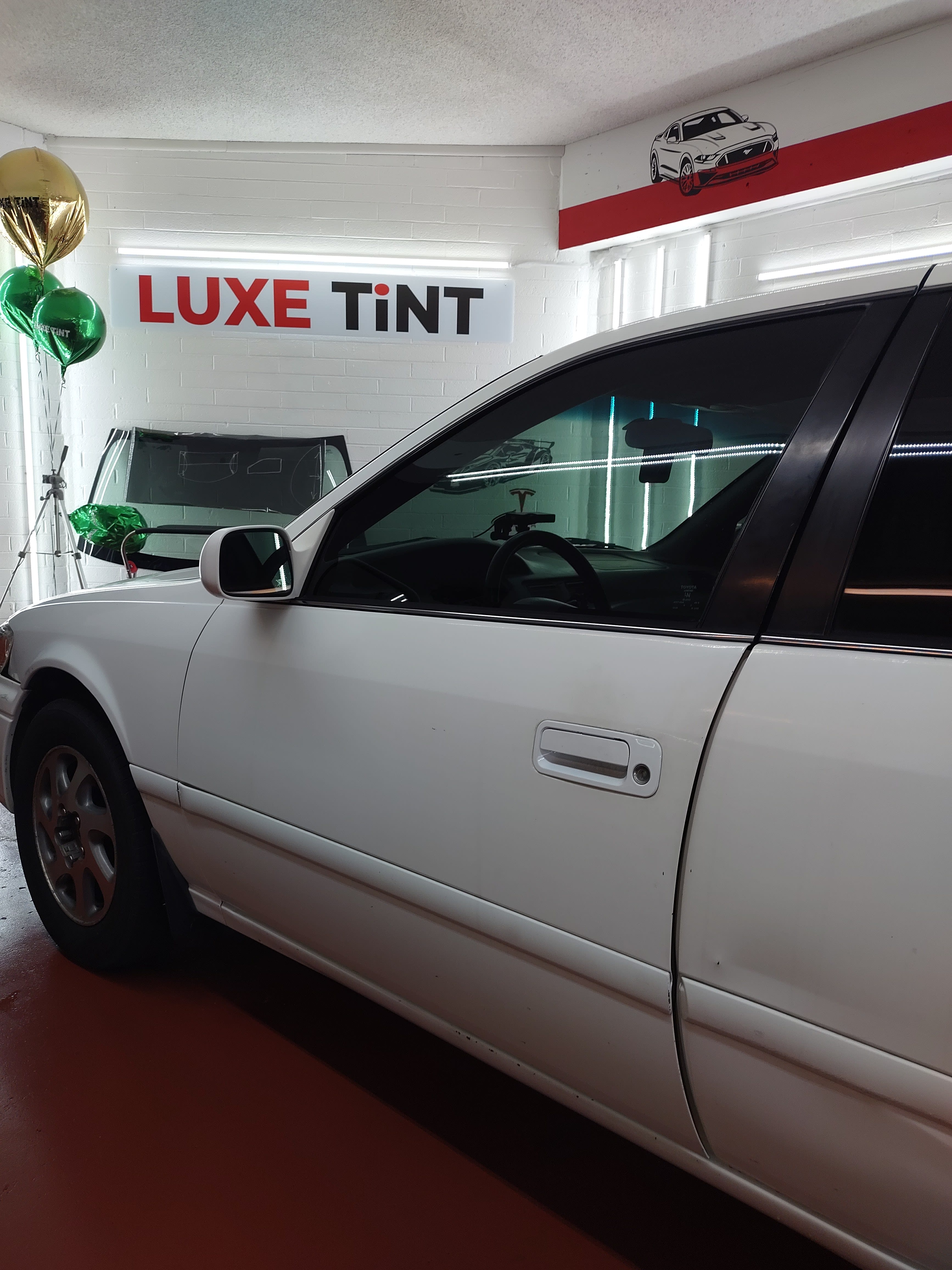 White Toyota Camry, side glass