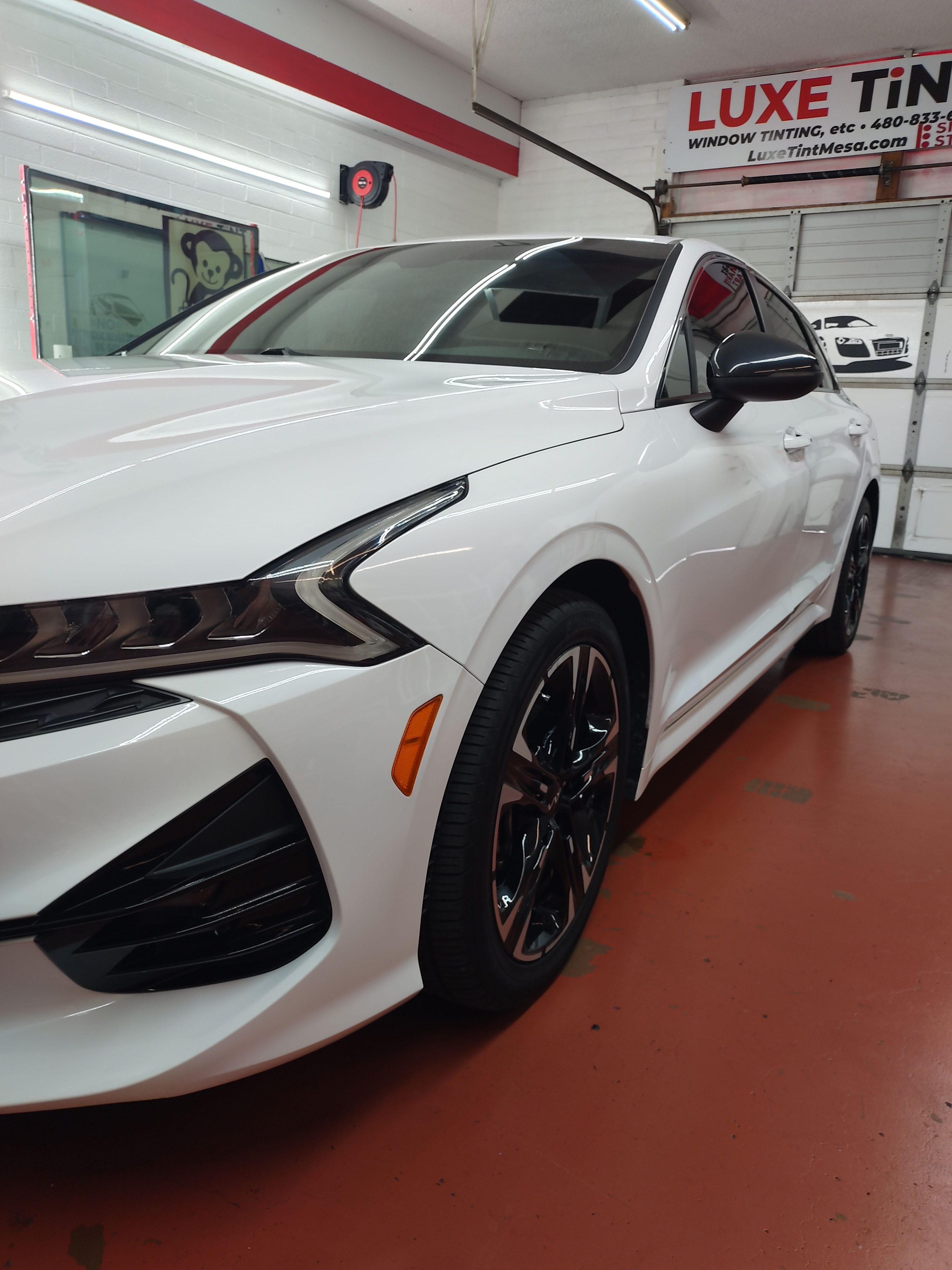 White Kia Stinger, front three-quarter