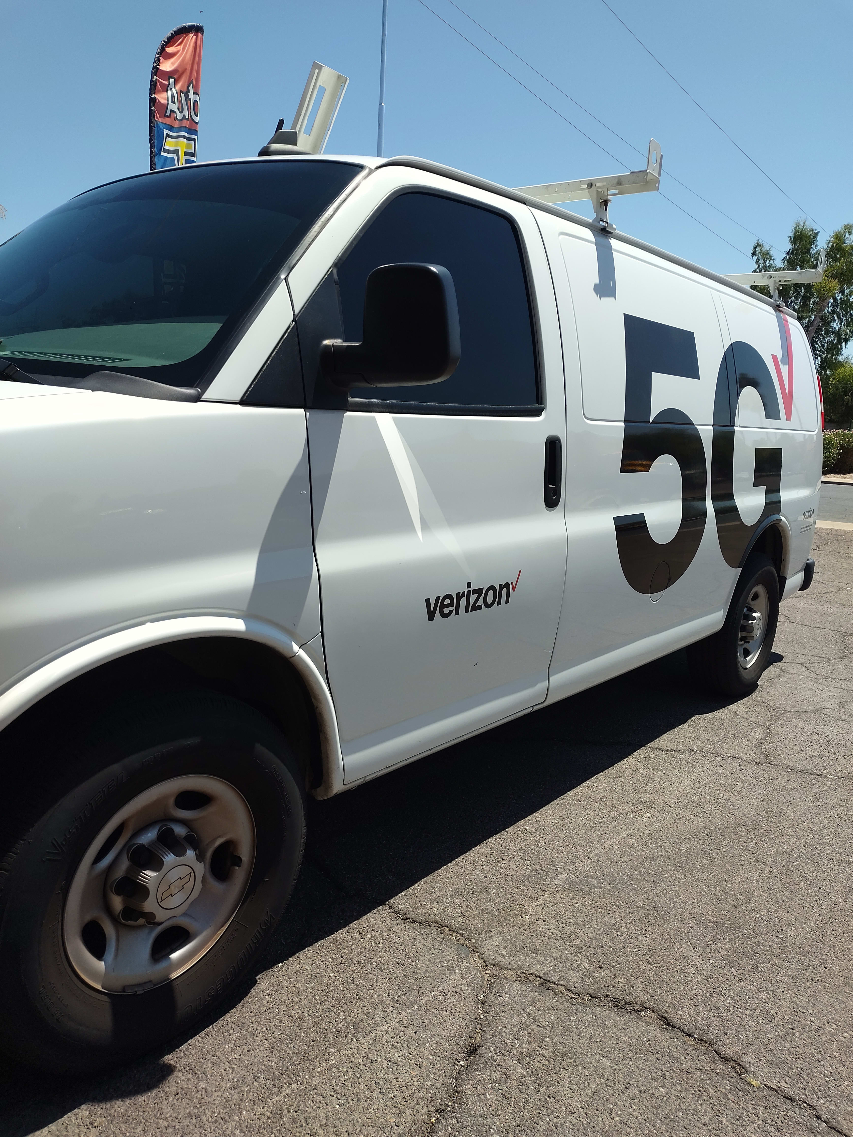 White Chevy Express van, side