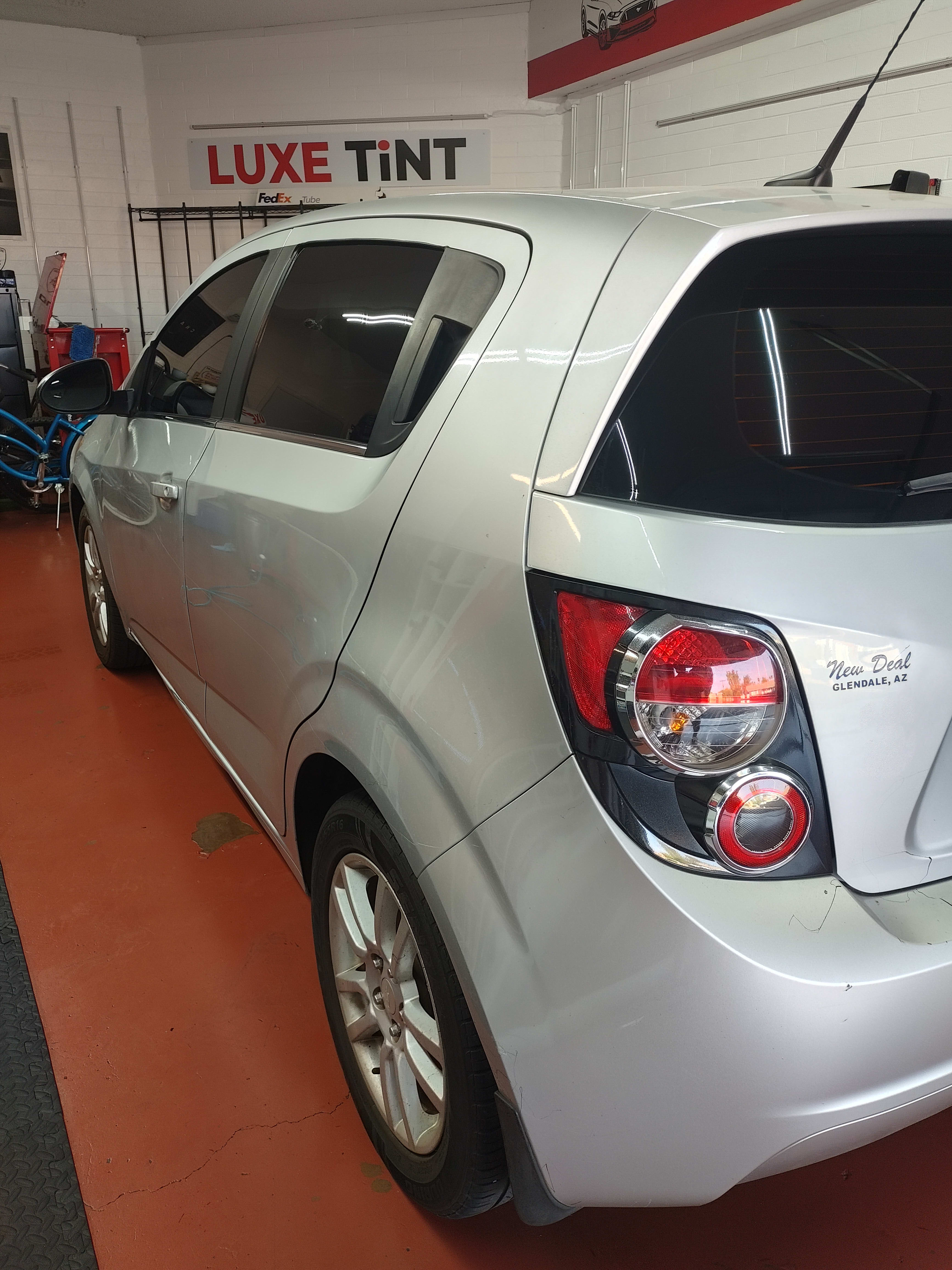 Silver Chevy Sonic, rear three-quarter