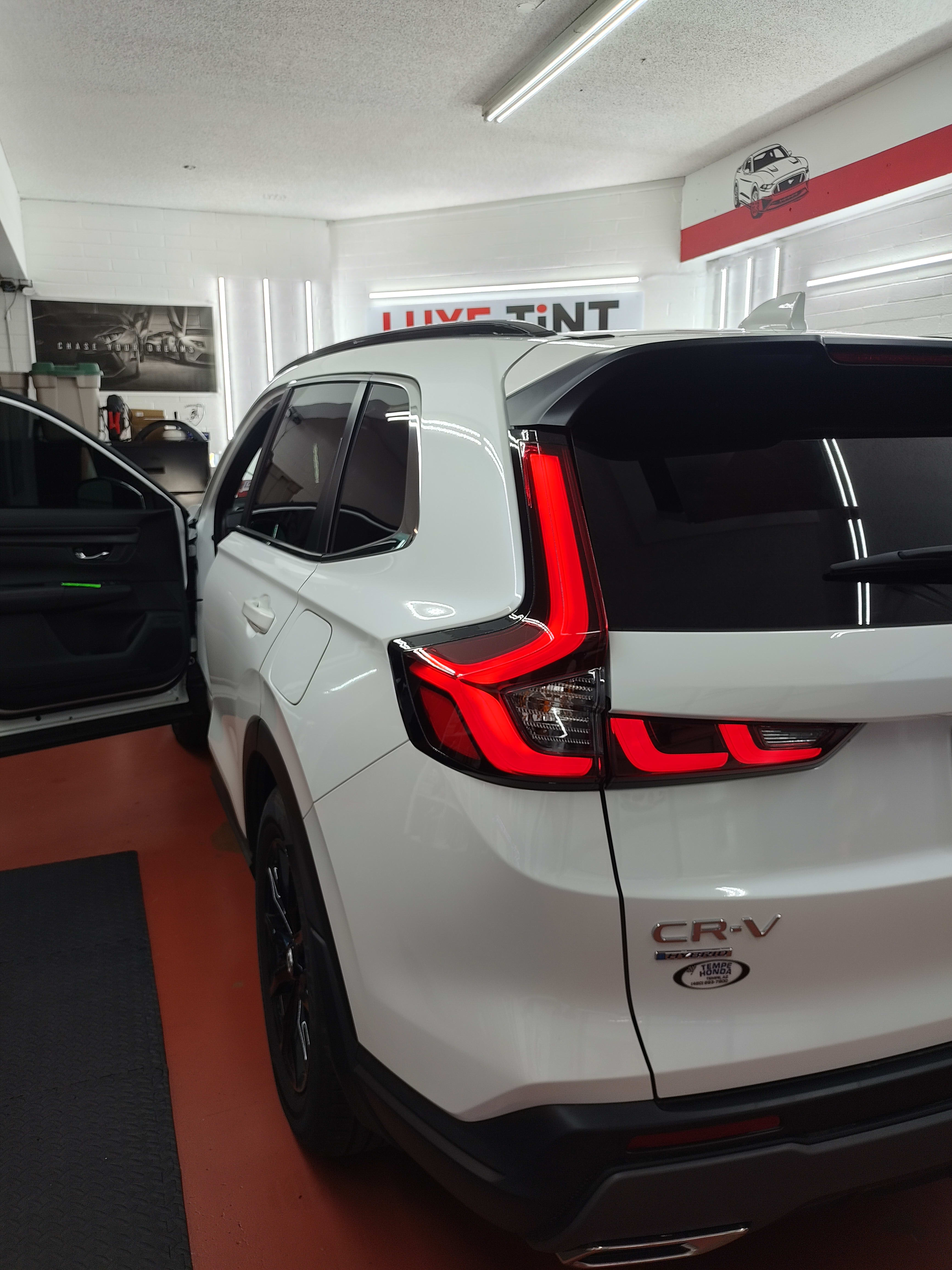 White Honda CR-V, rear three-quarter
