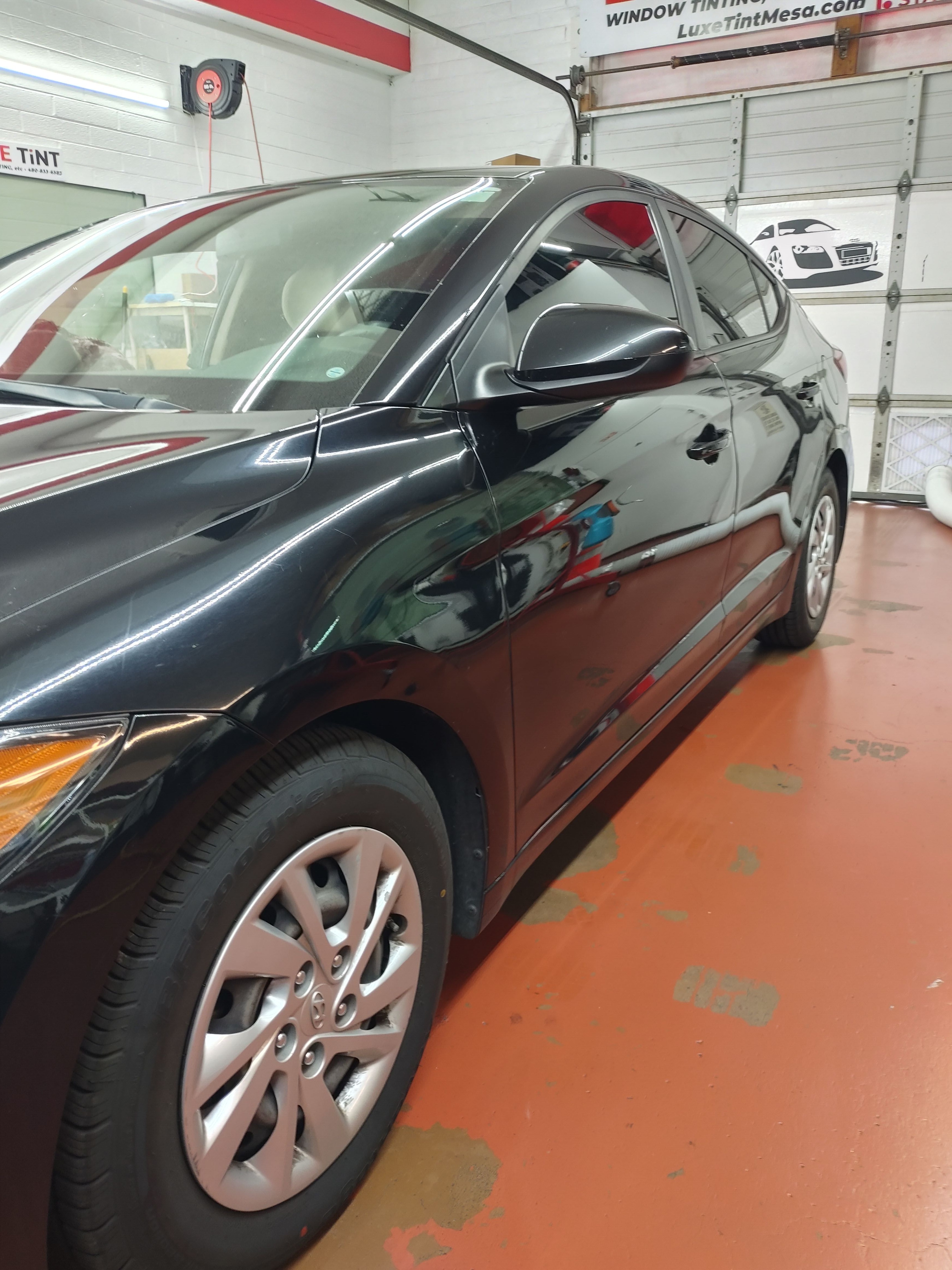 Dark grey Hyundai sedan, side