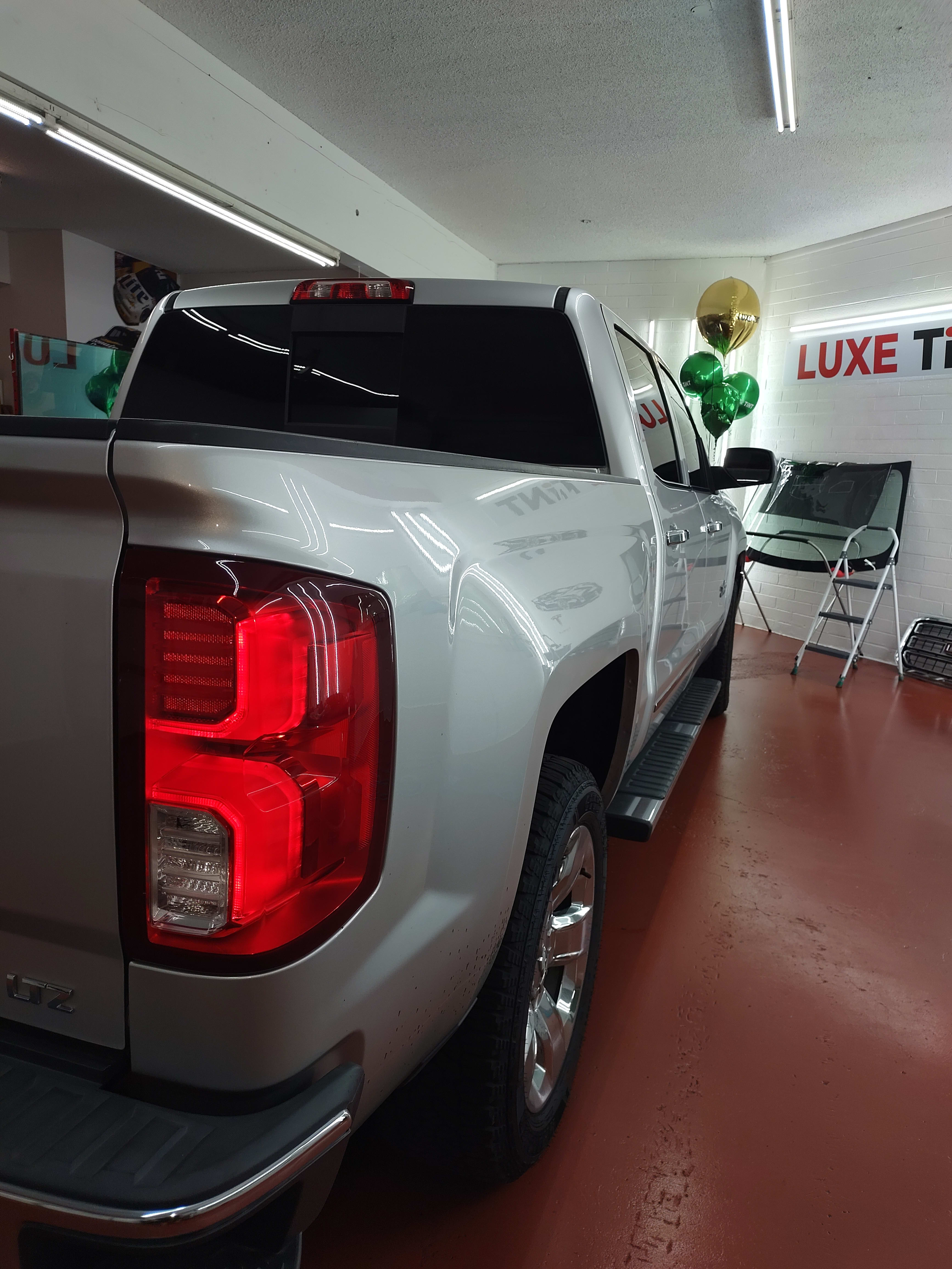 Silver Chevy Silverado, rear