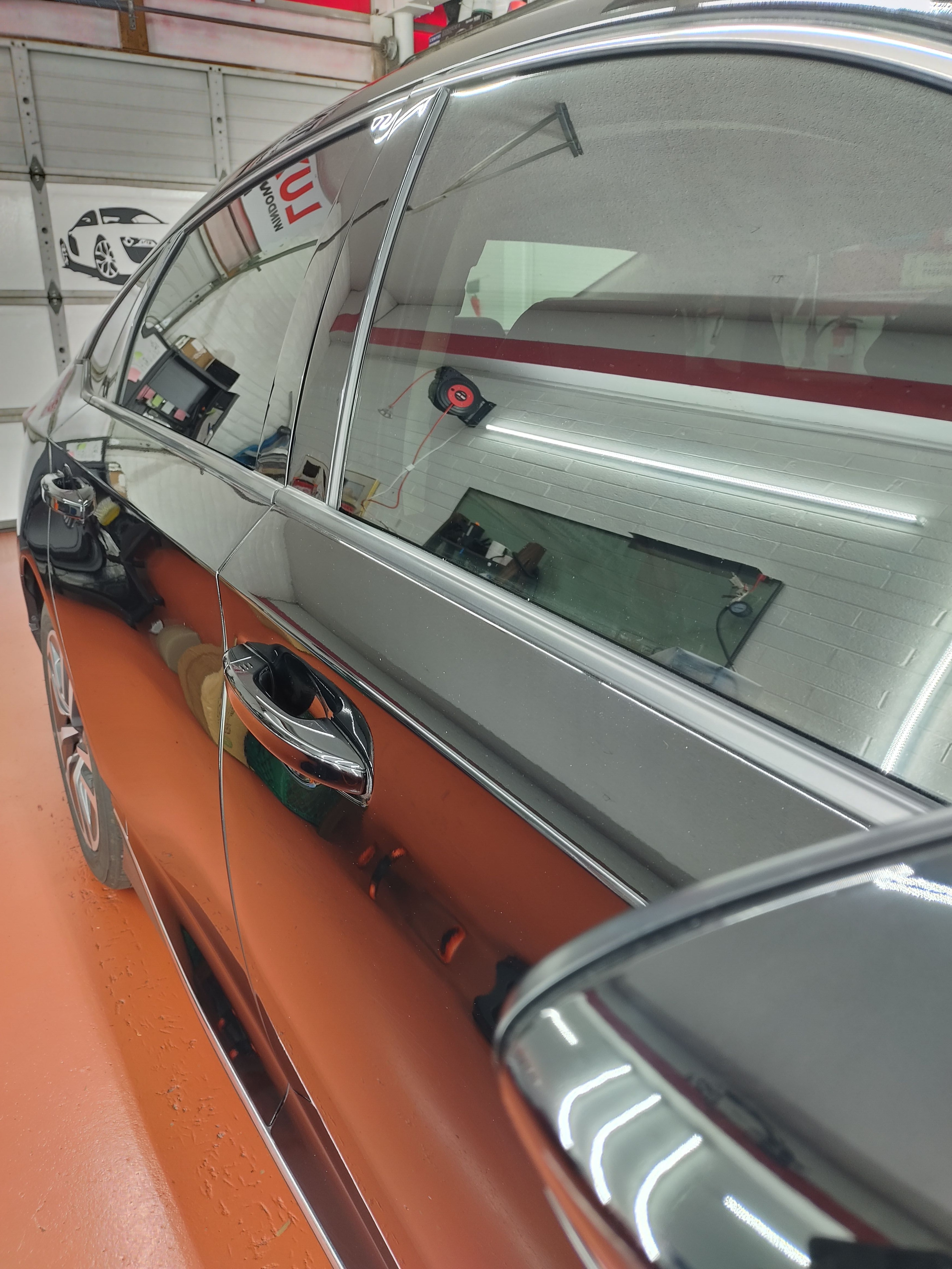 Silver sedan, rear side glass