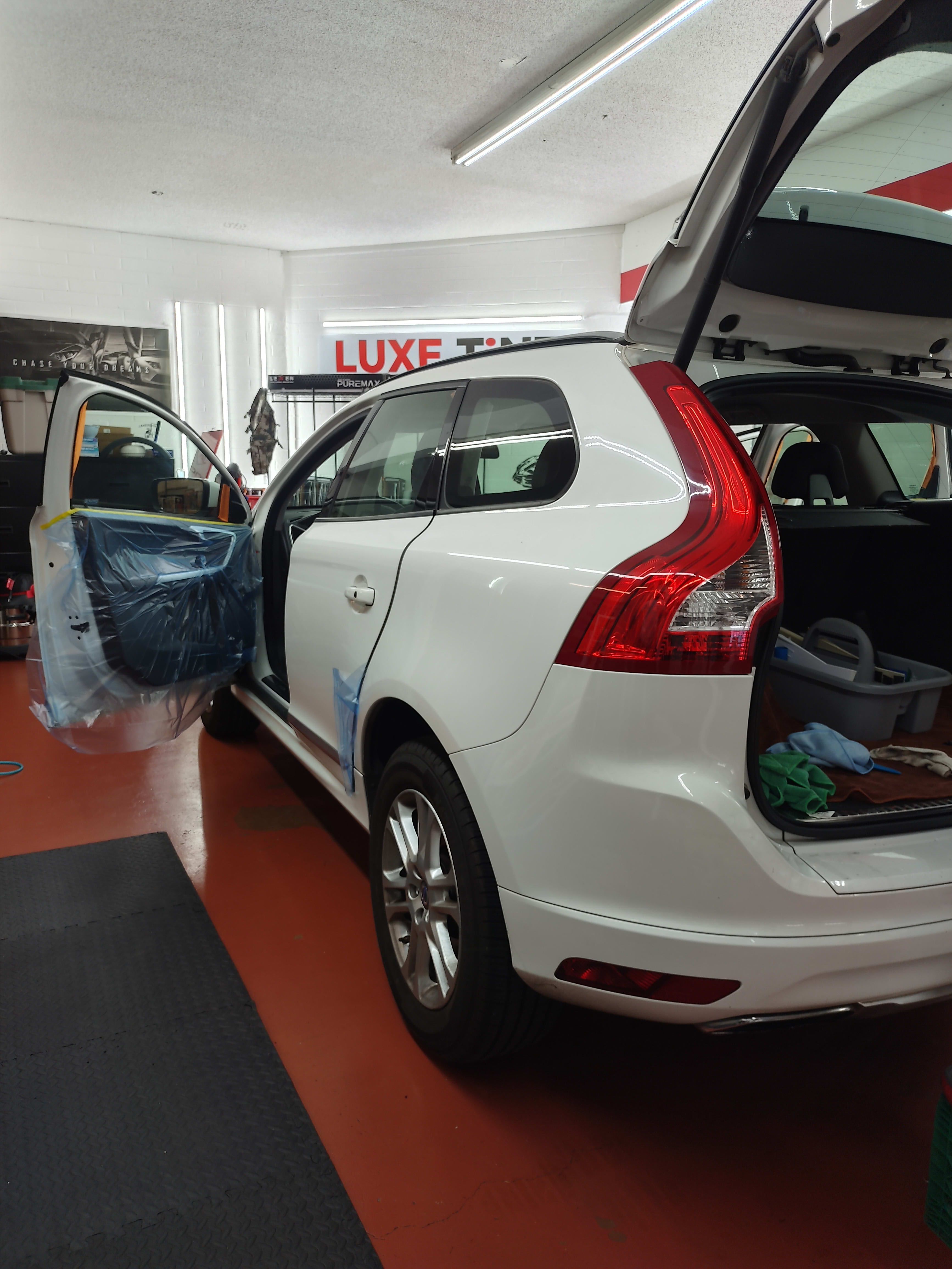 White Volvo XC60, rear three-quarter