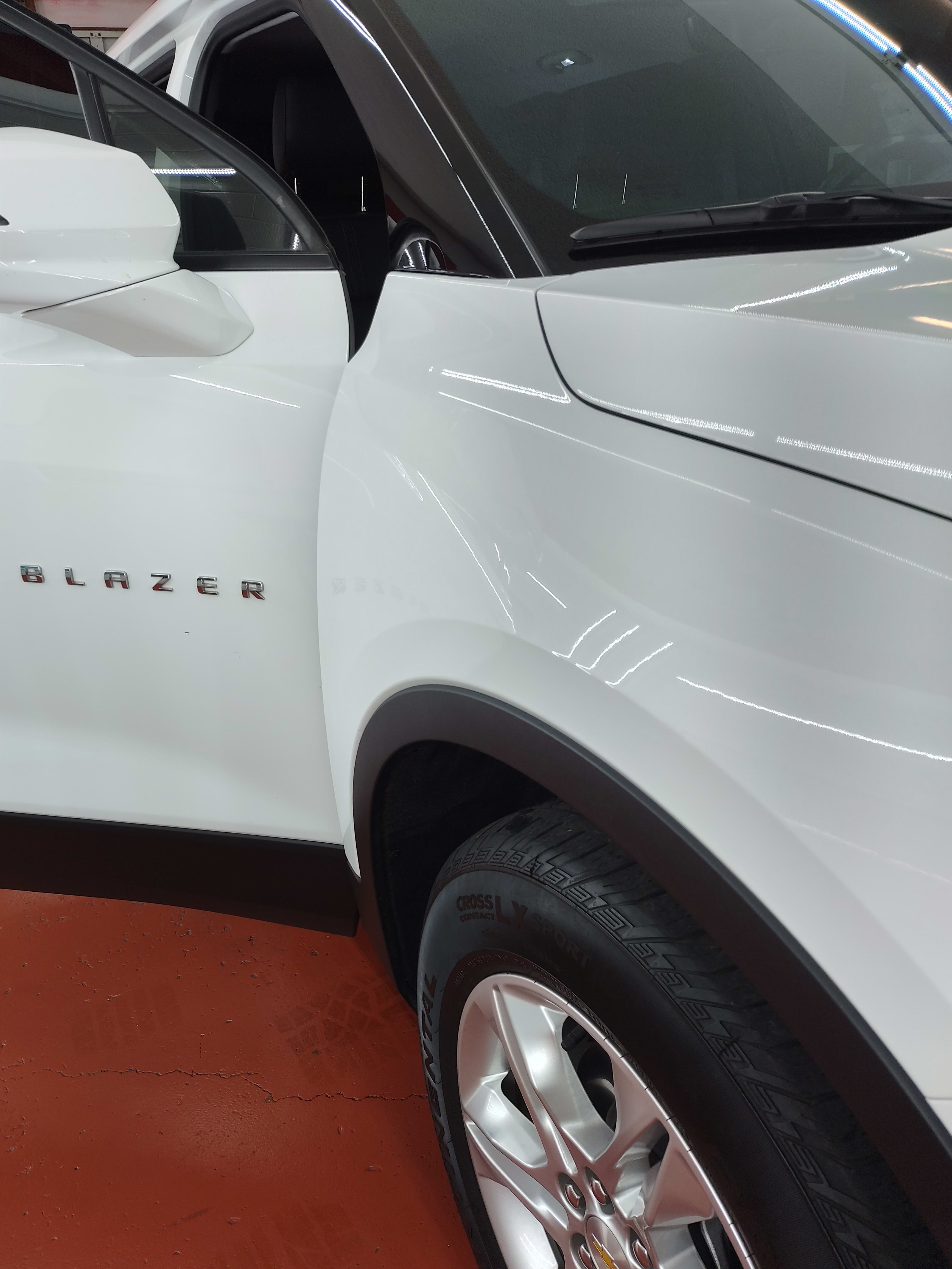 White Chevy Blazer, front door
