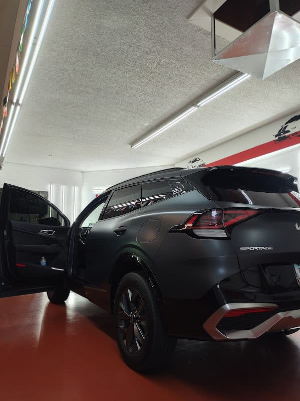 Matte grey Kia Sportage, rear three-quarter