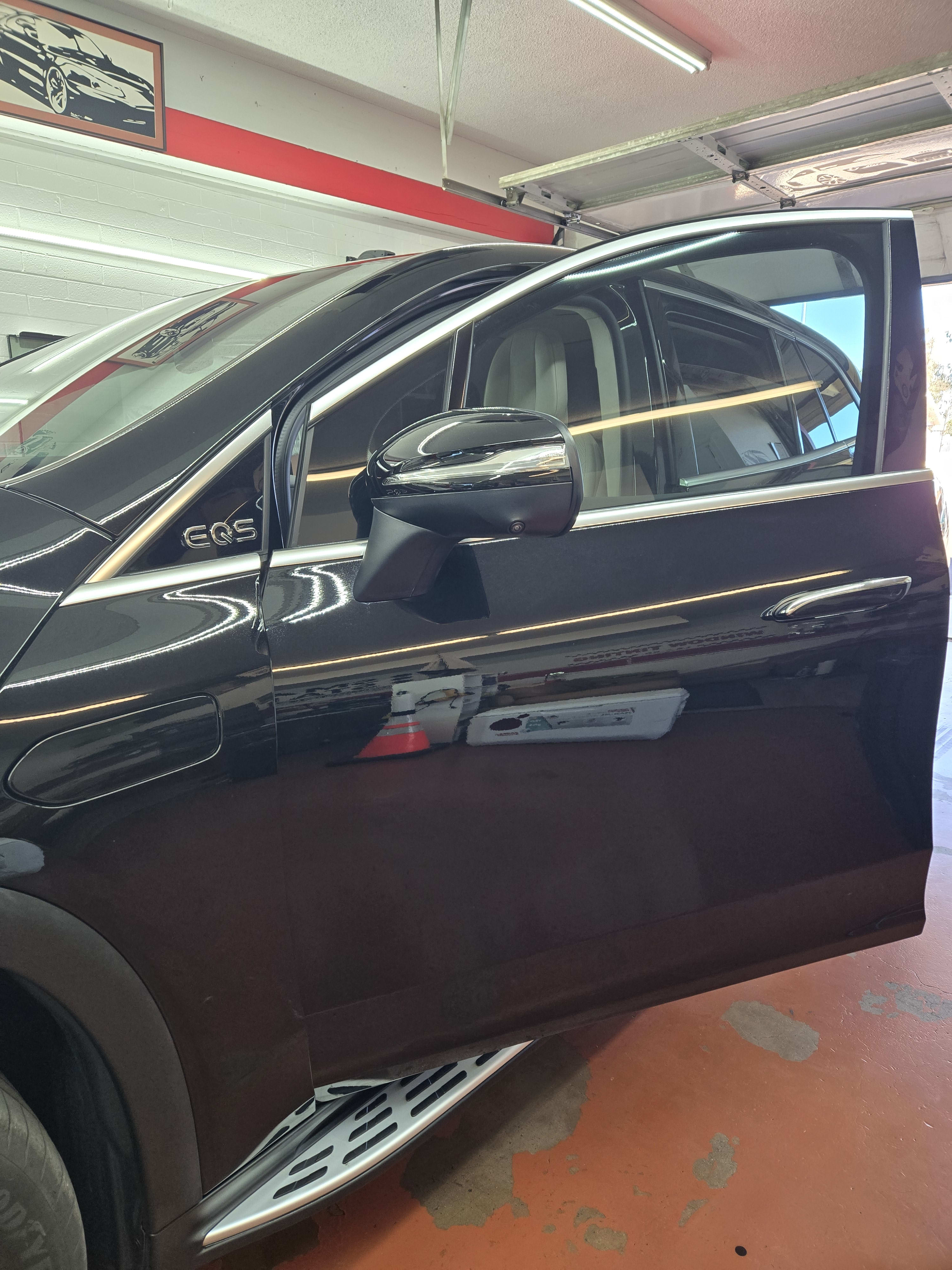 Black Mercedes EQS, side glass