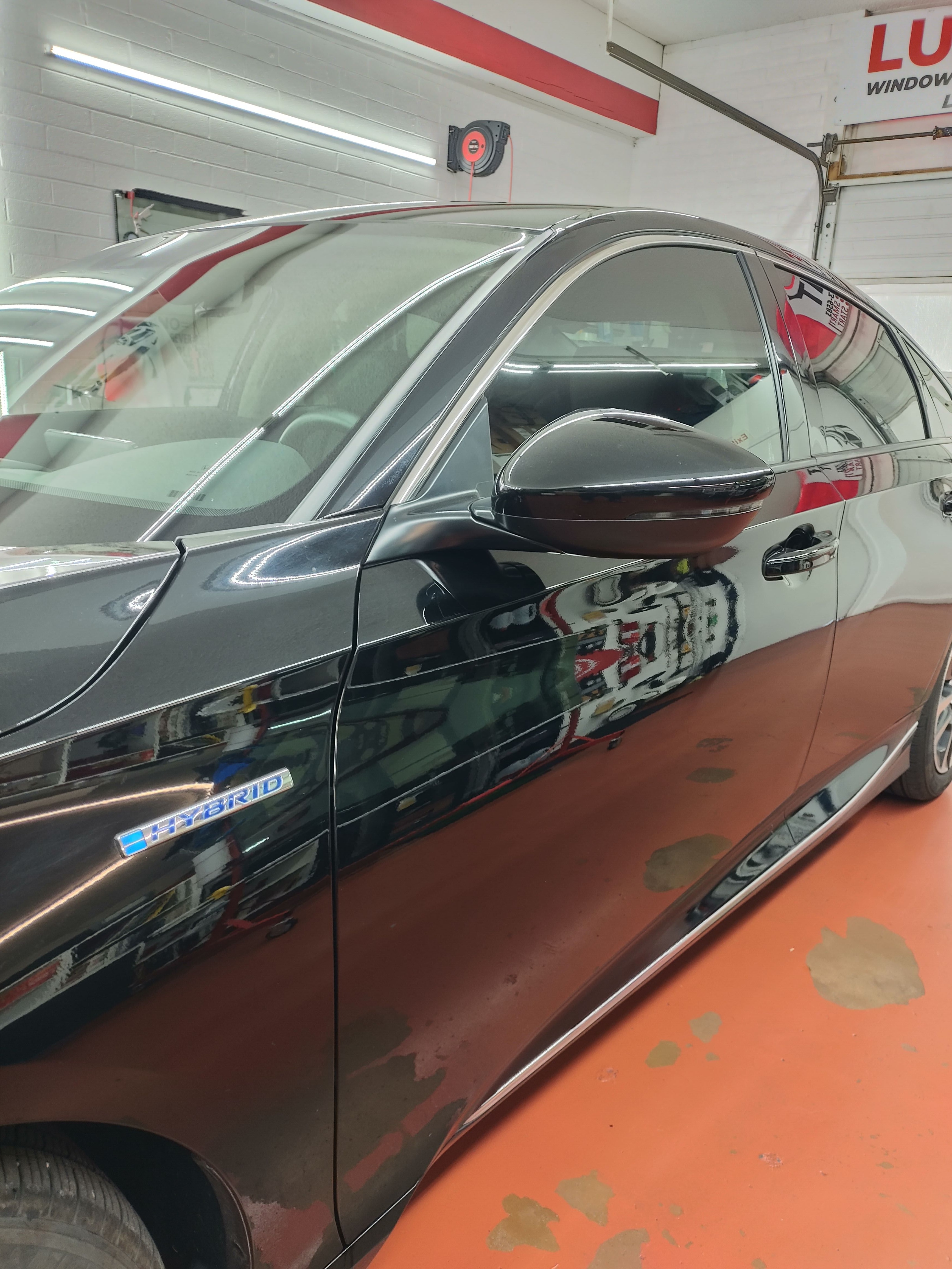 Grey hybrid sedan, side glass