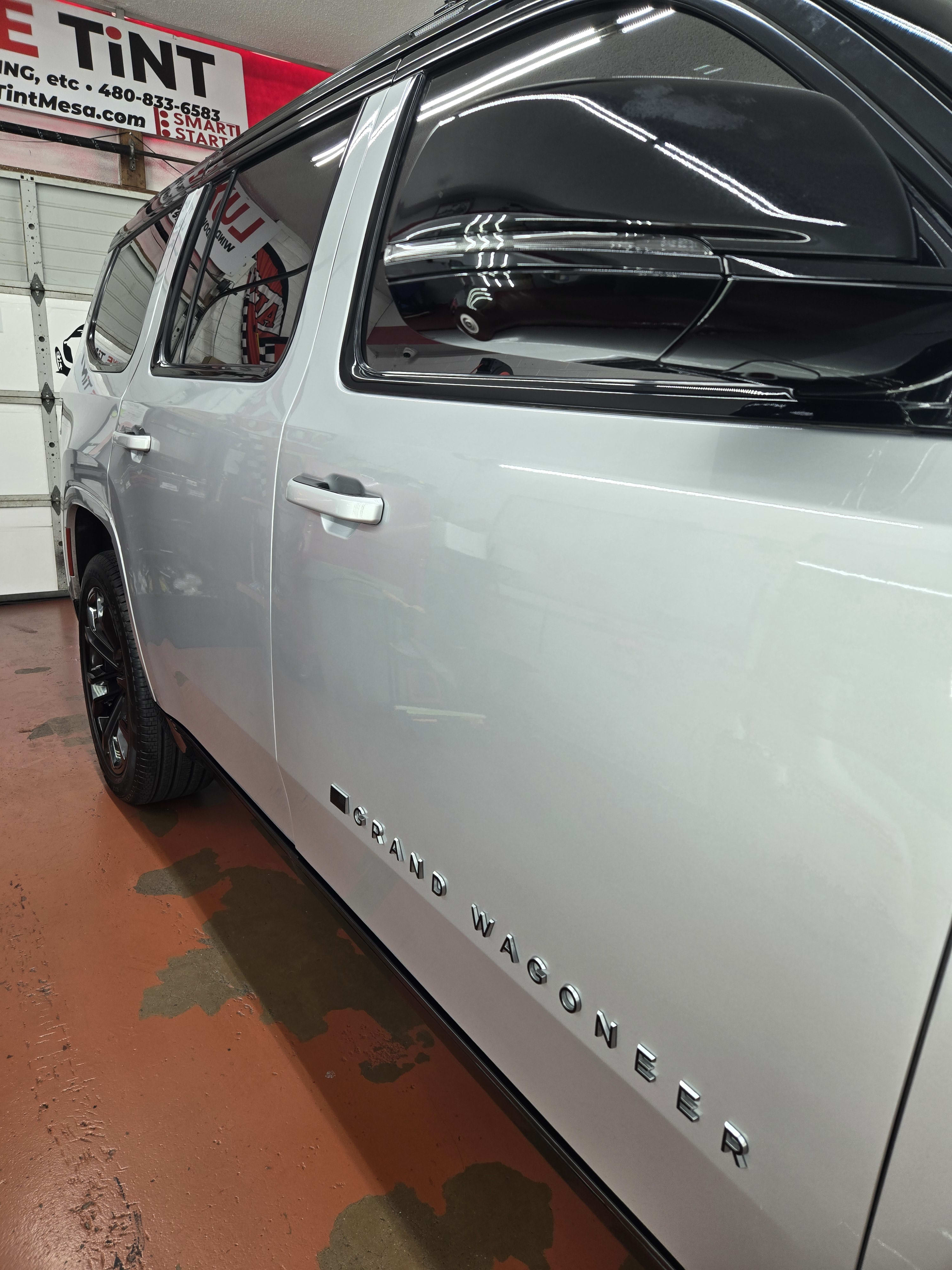 Silver Chevy Suburban, side glass