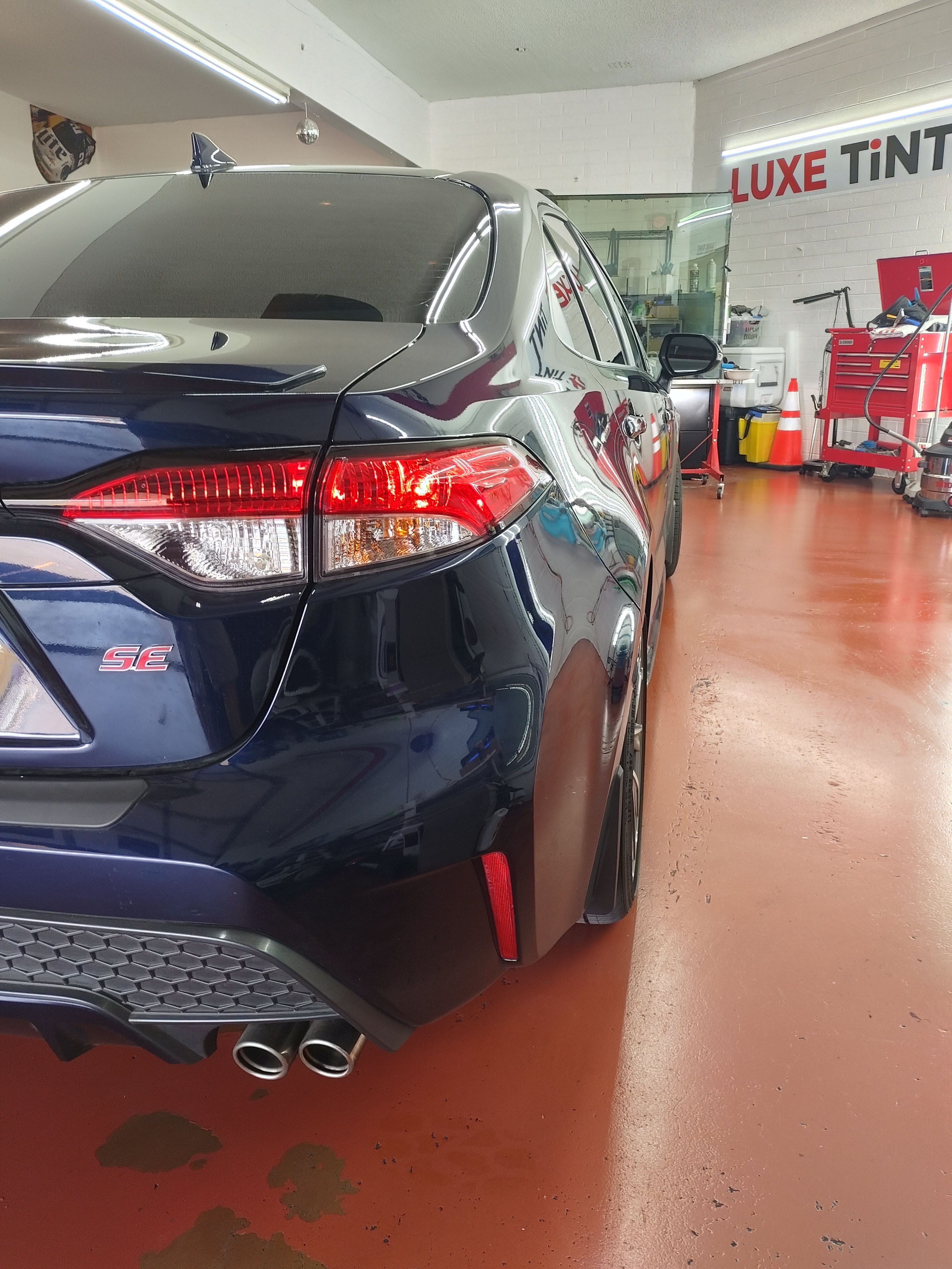 Dark blue Nissan Maxima, rear