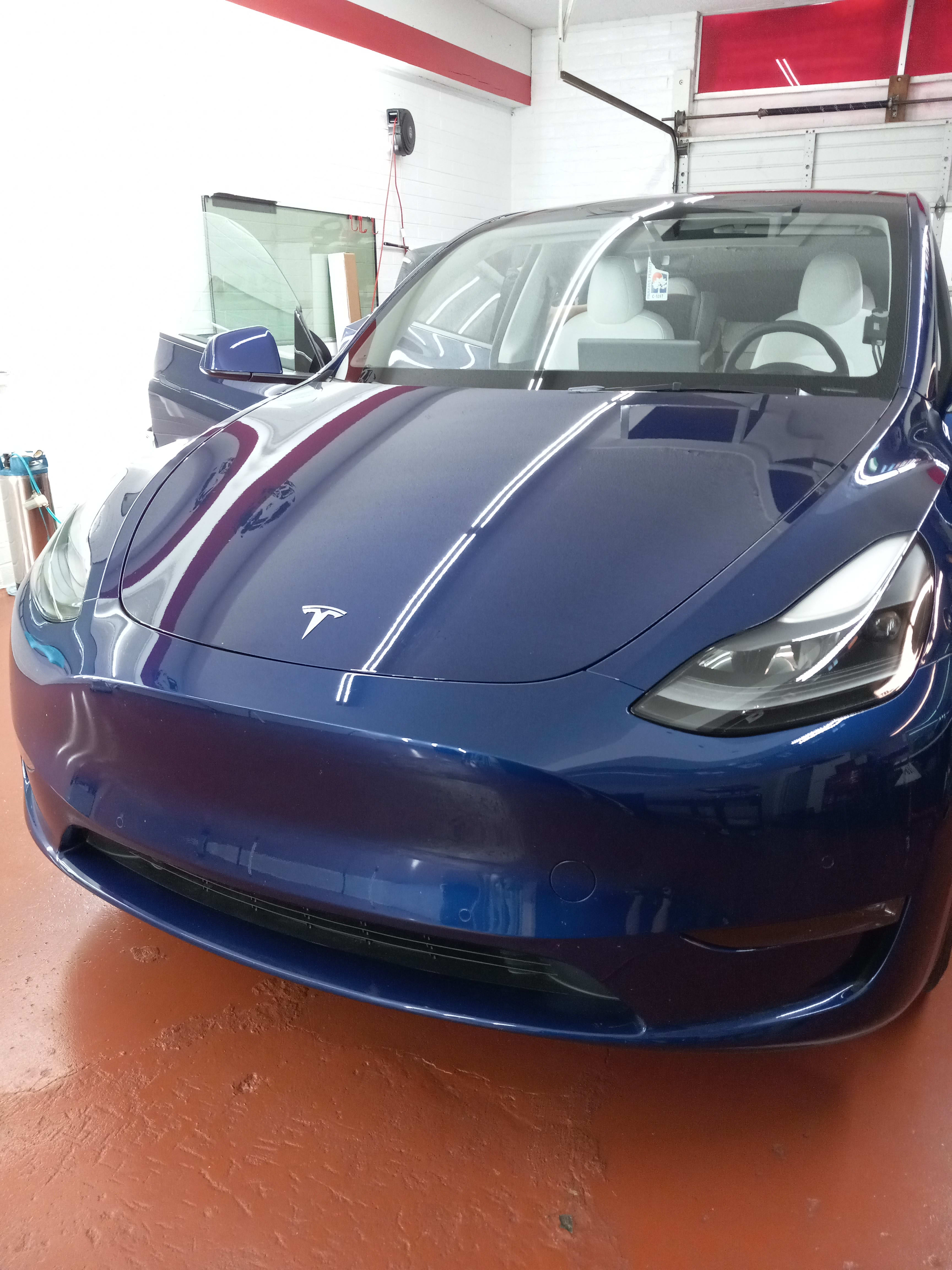 Blue Tesla Model Y, front