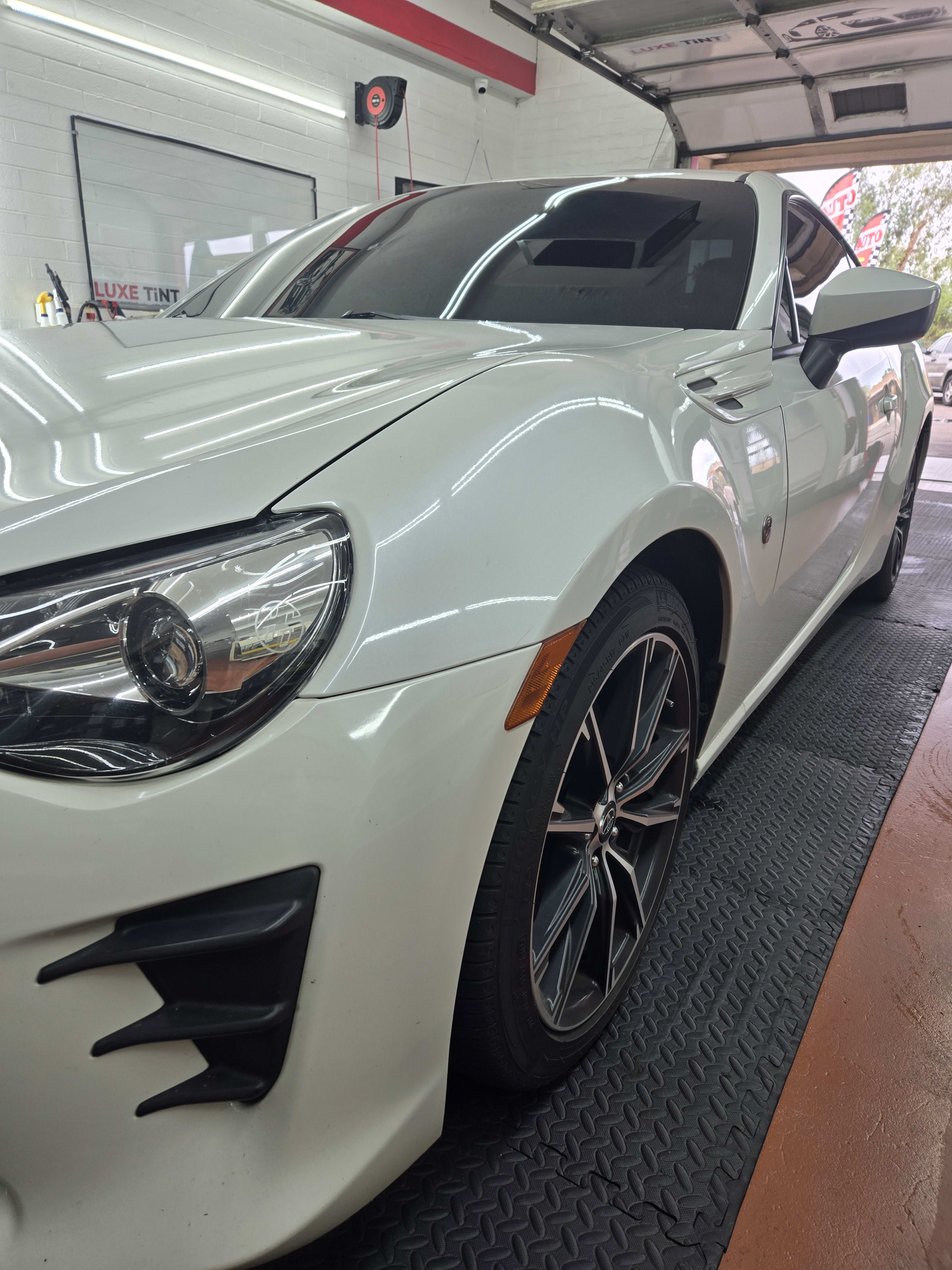 White Toyota 86, front three-quarter