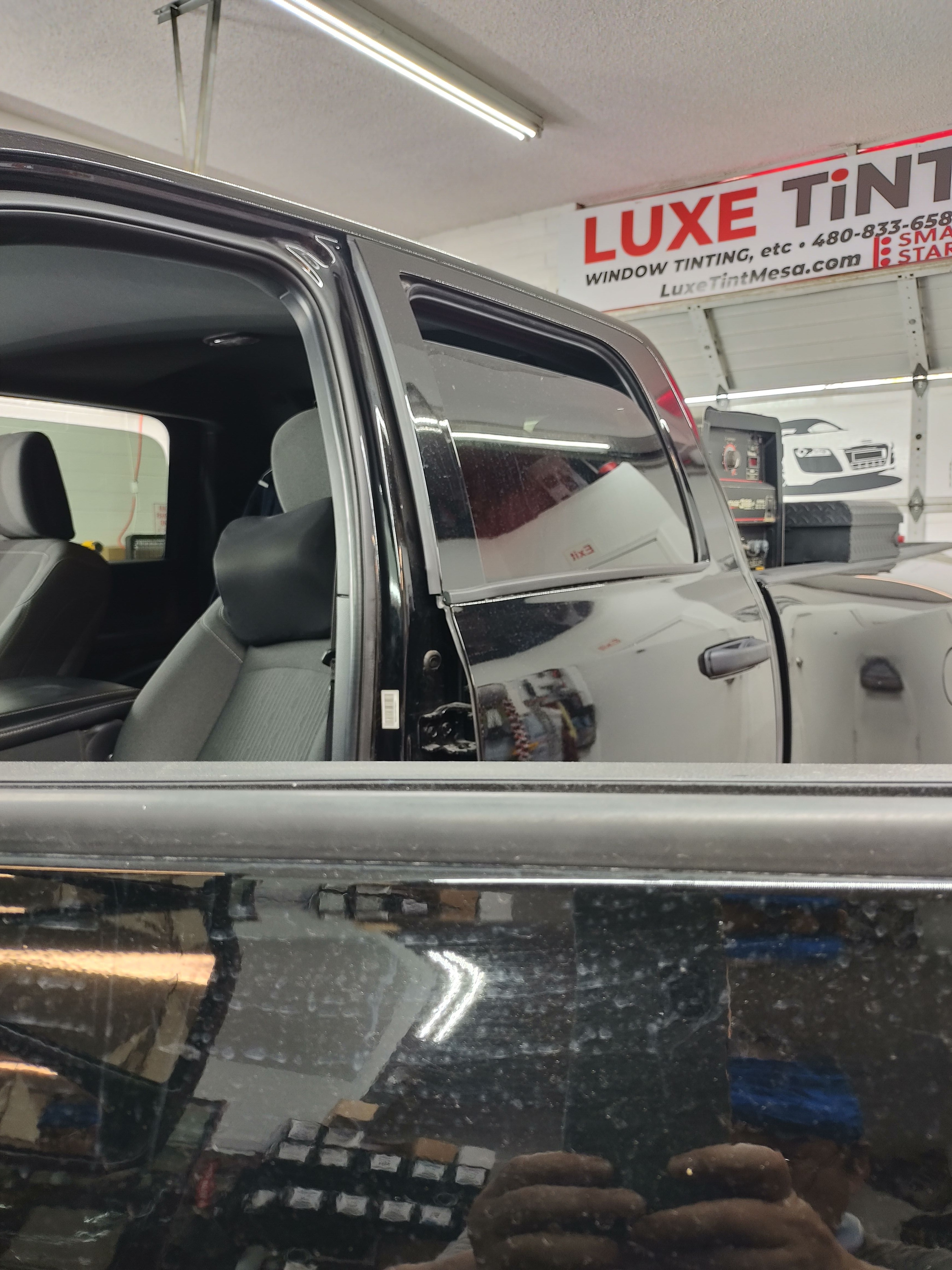 Black SUV, rear door glass