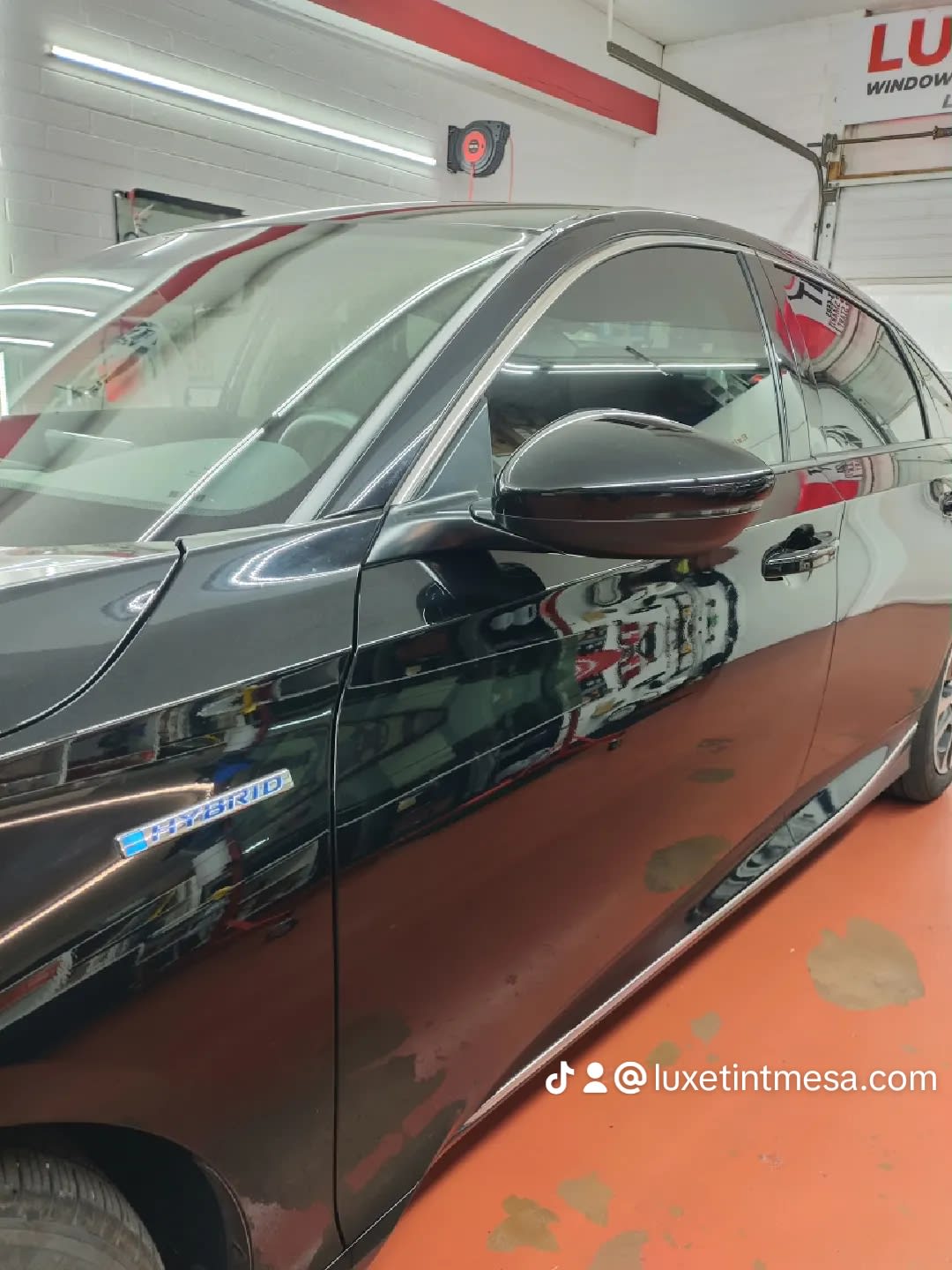 Black Honda Accord Hybrid, side