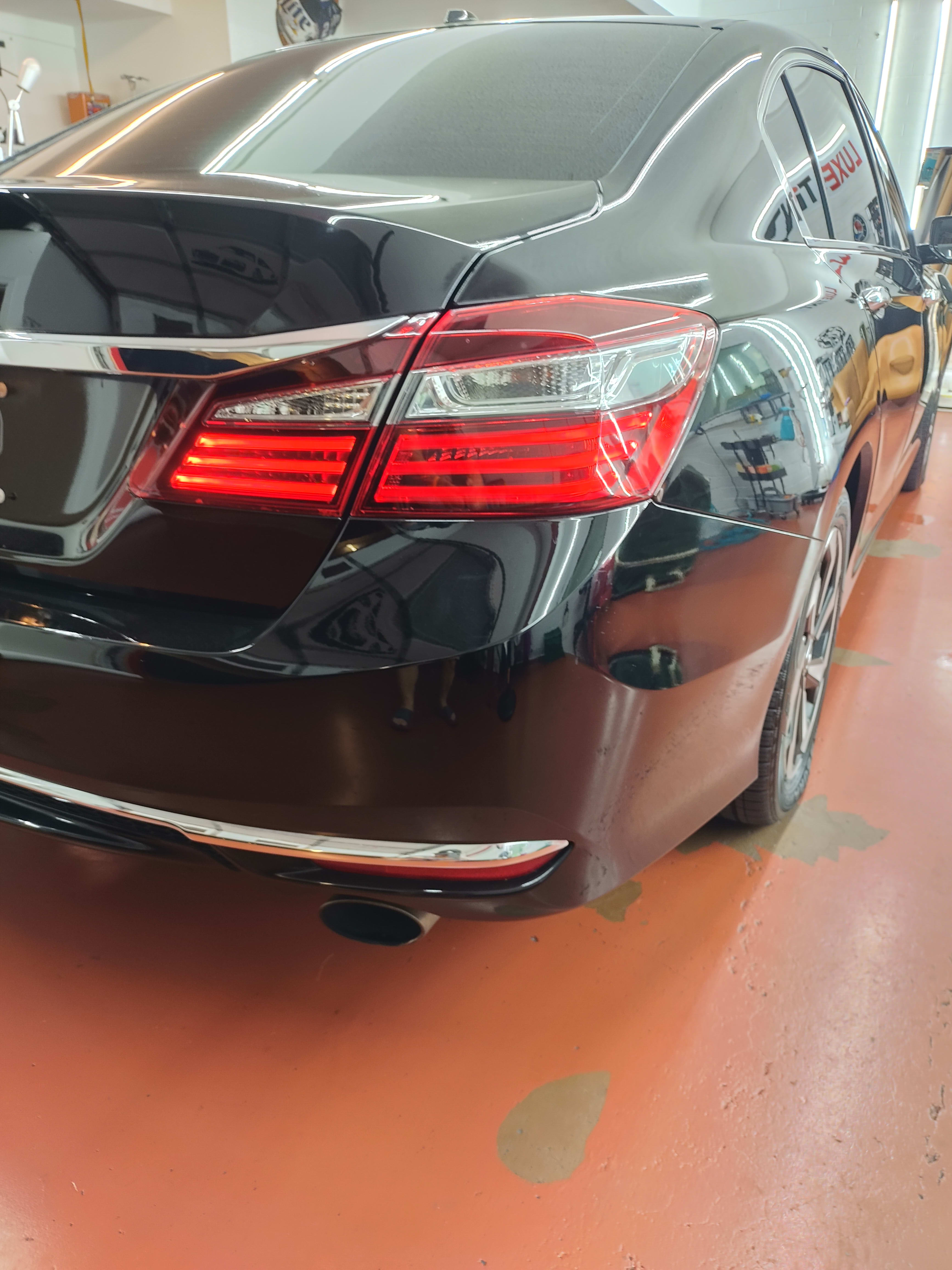 Black Honda Accord, rear three-quarter