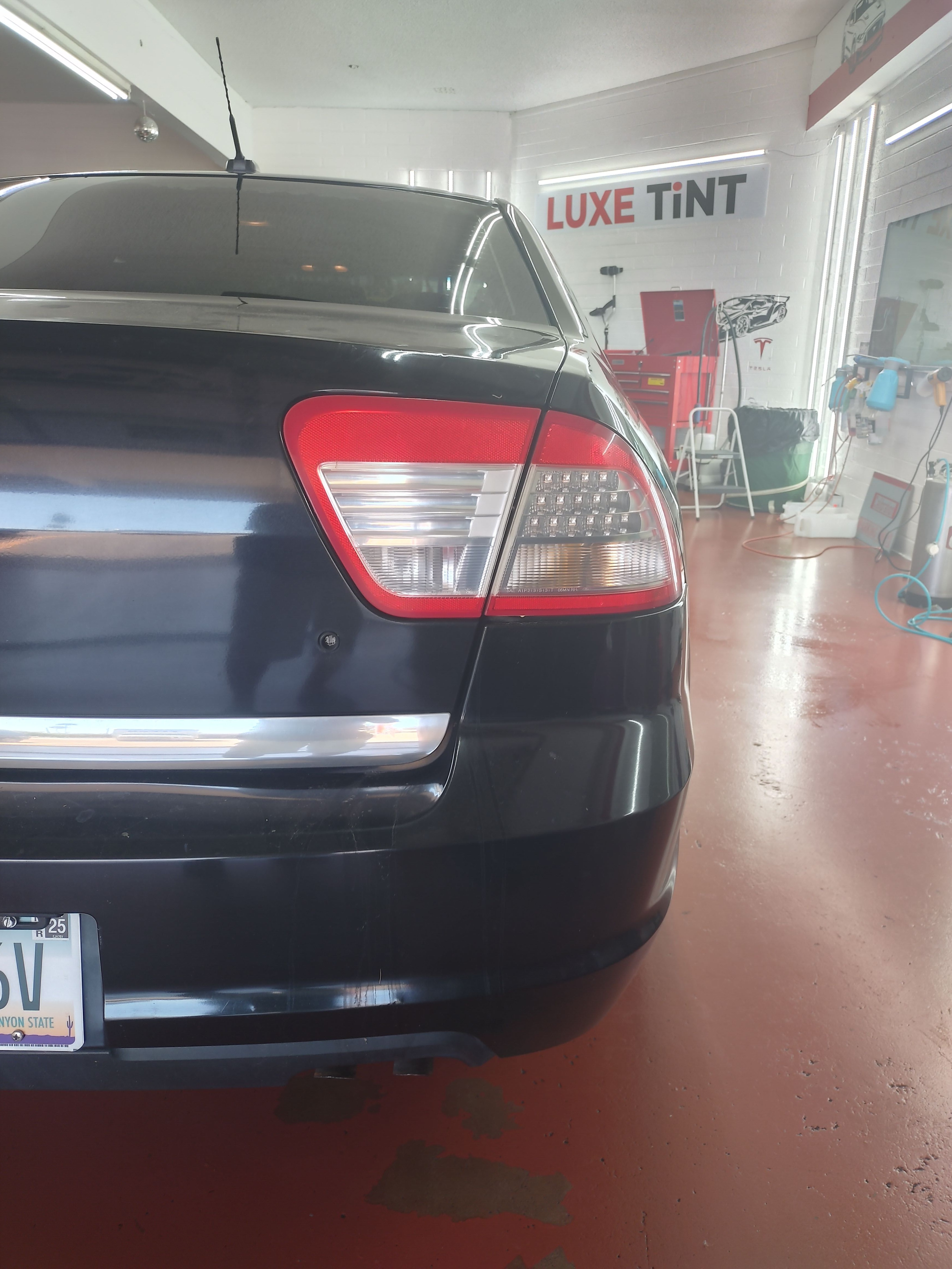 Black Dodge SUV, rear