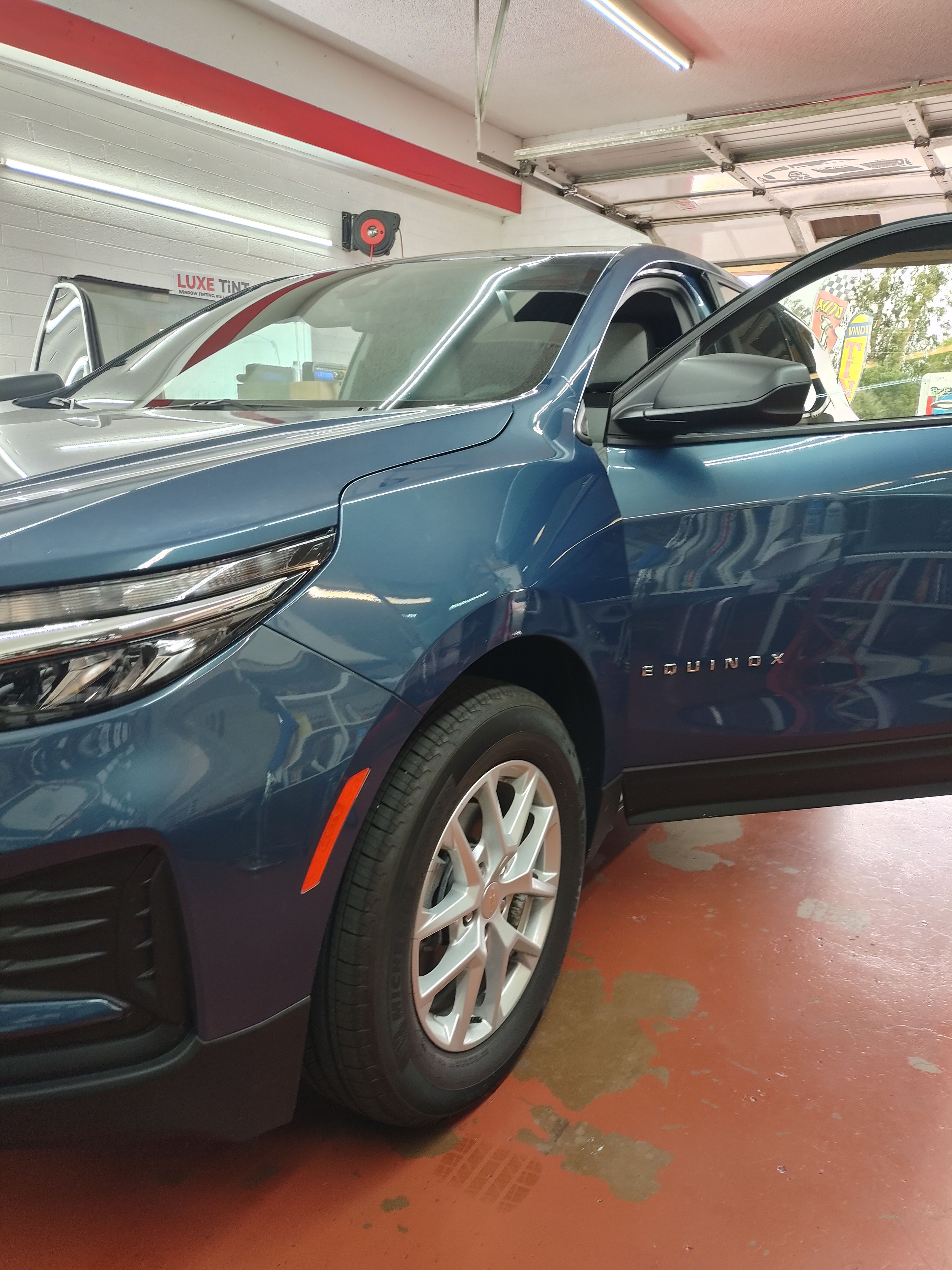 Blue Chevy Equinox, front three-quarter