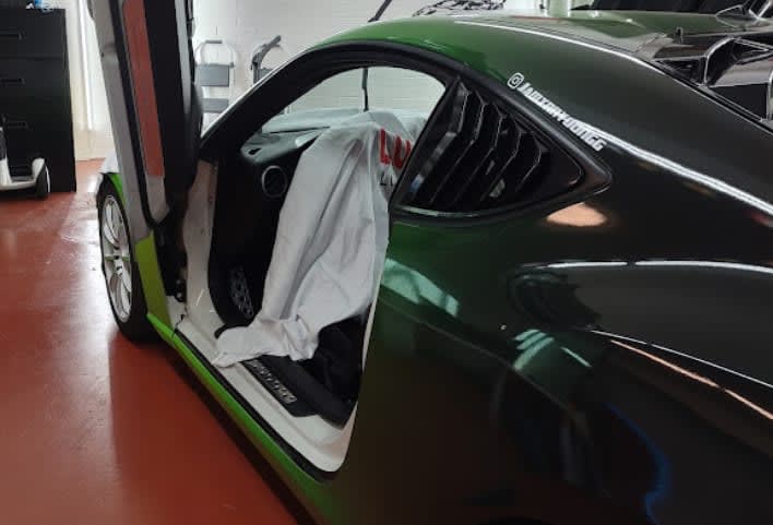 Green Dodge Challenger, side with door open