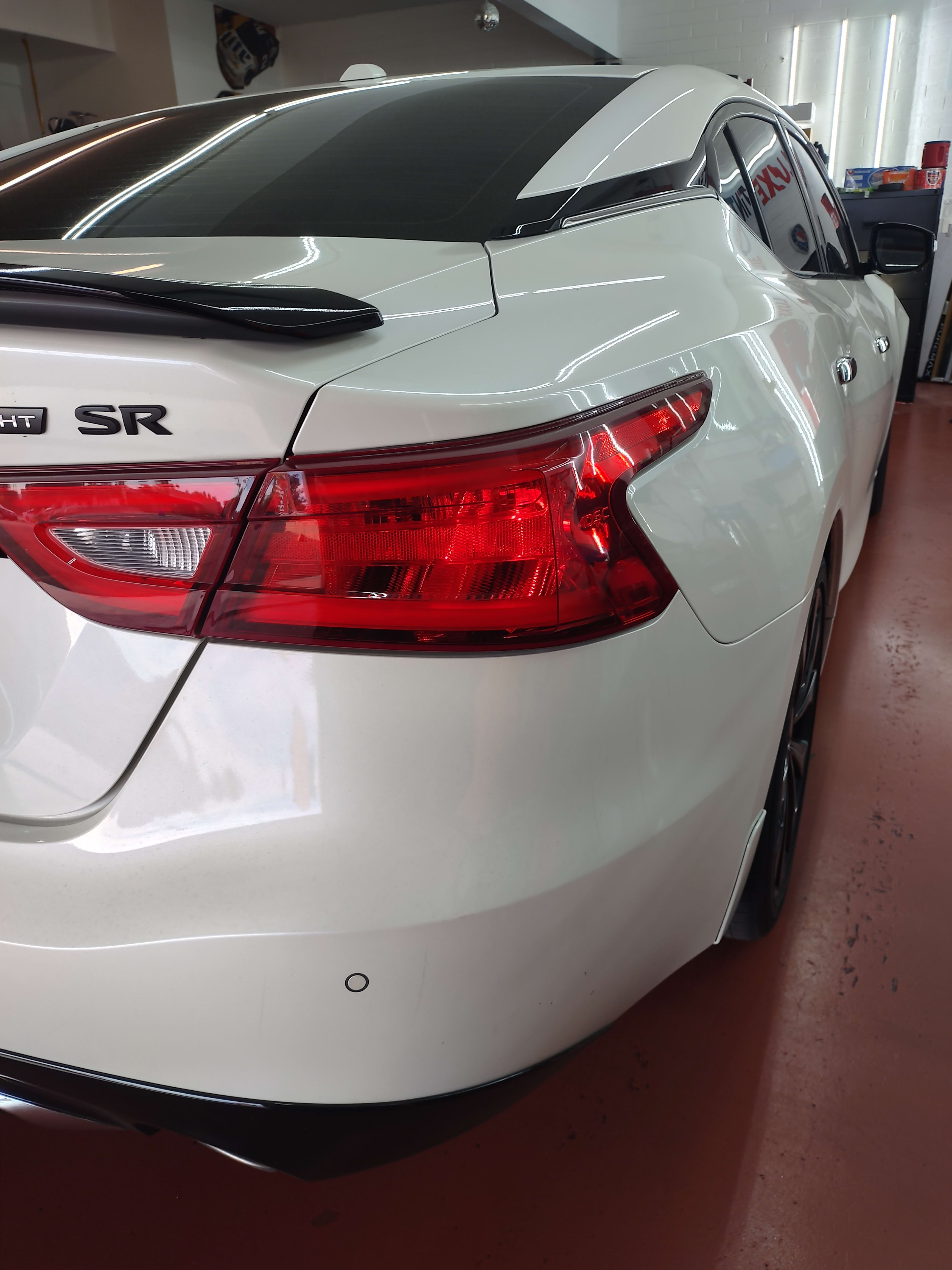 White Nissan Maxima SR, rear quarter