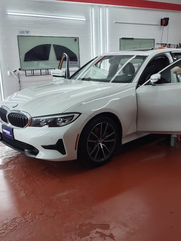 White BMW 3 Series, front three-quarter