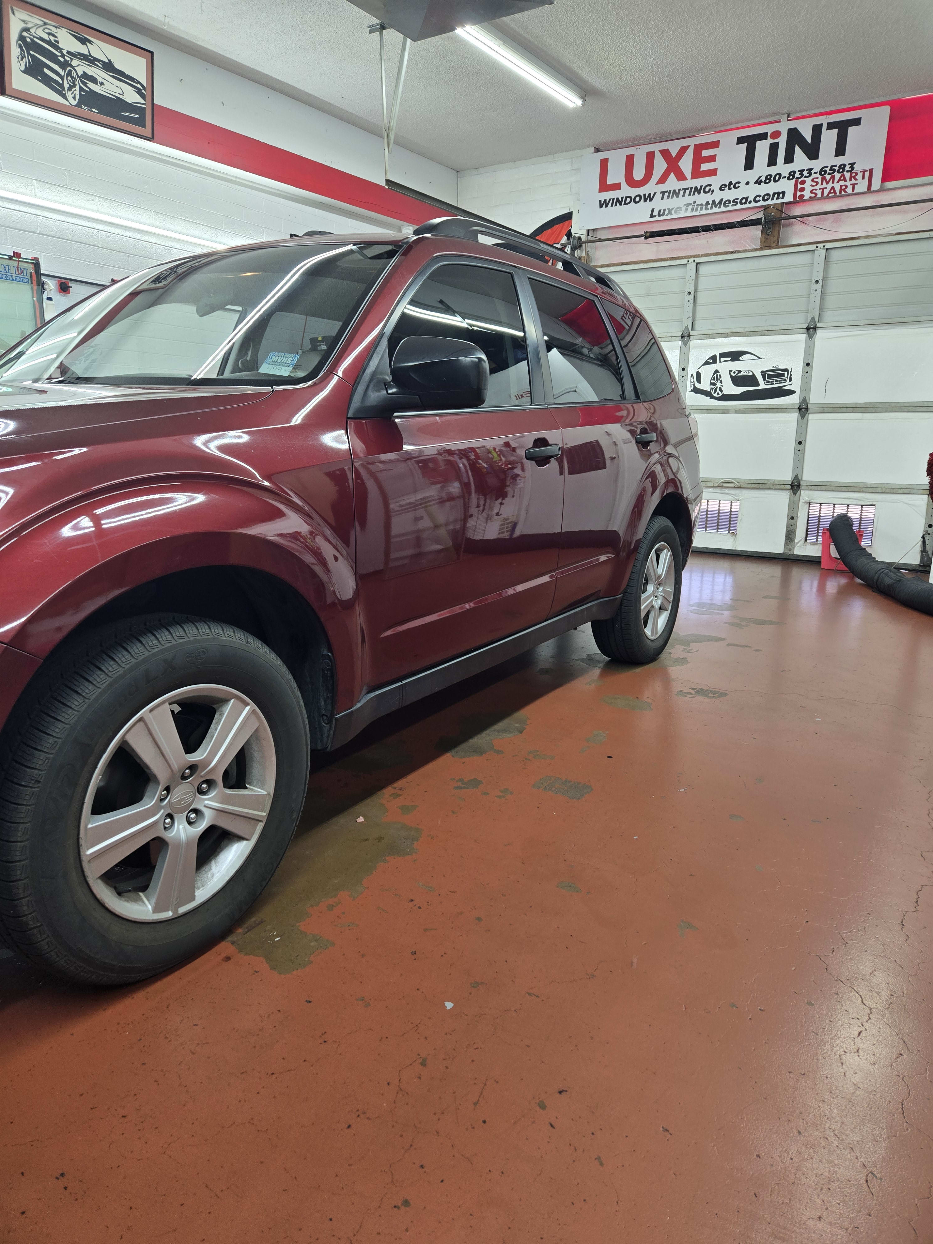 Maroon Subaru Forester, front three-quarter