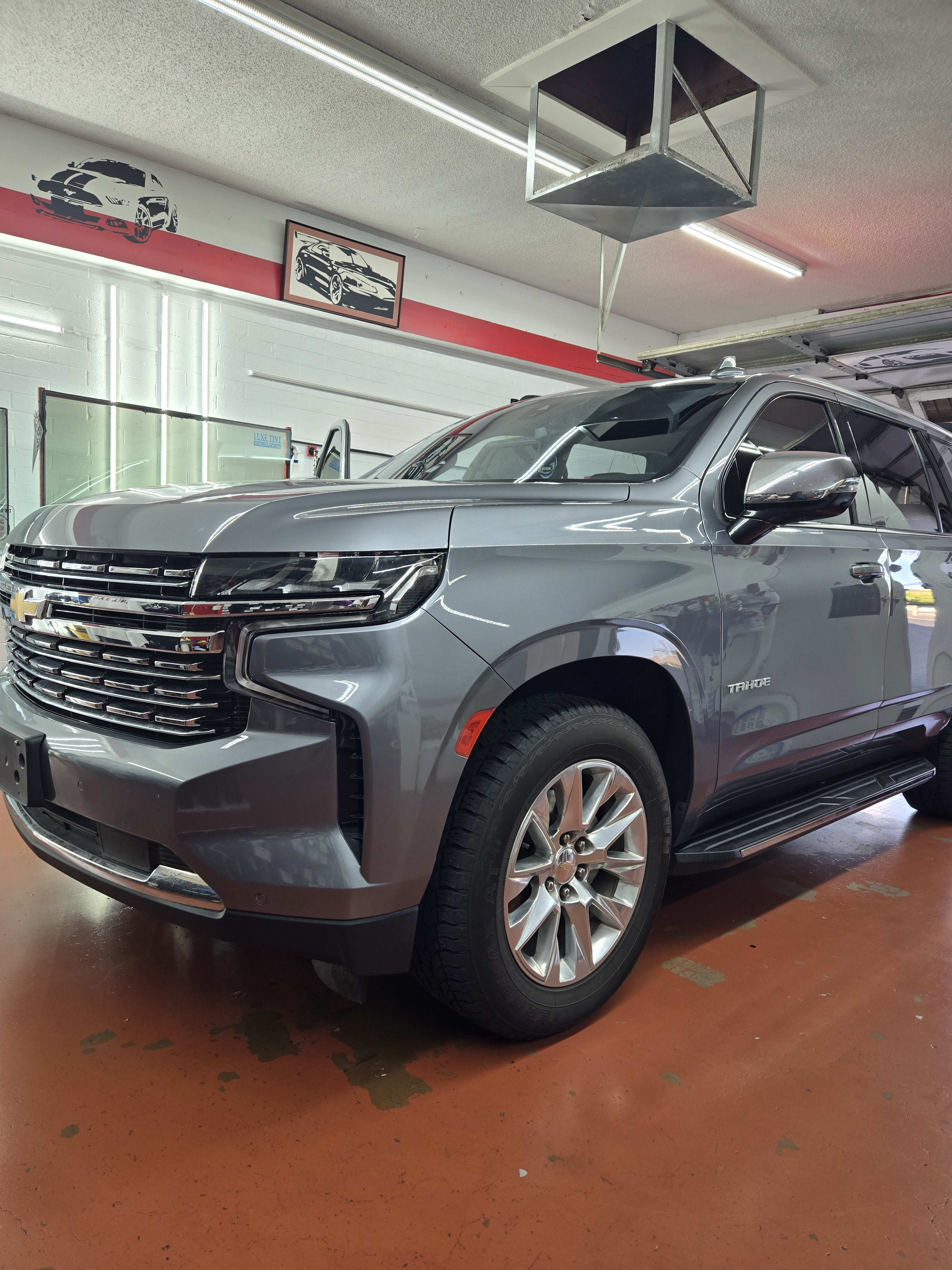 Grey Chevy Tahoe, front three-quarter