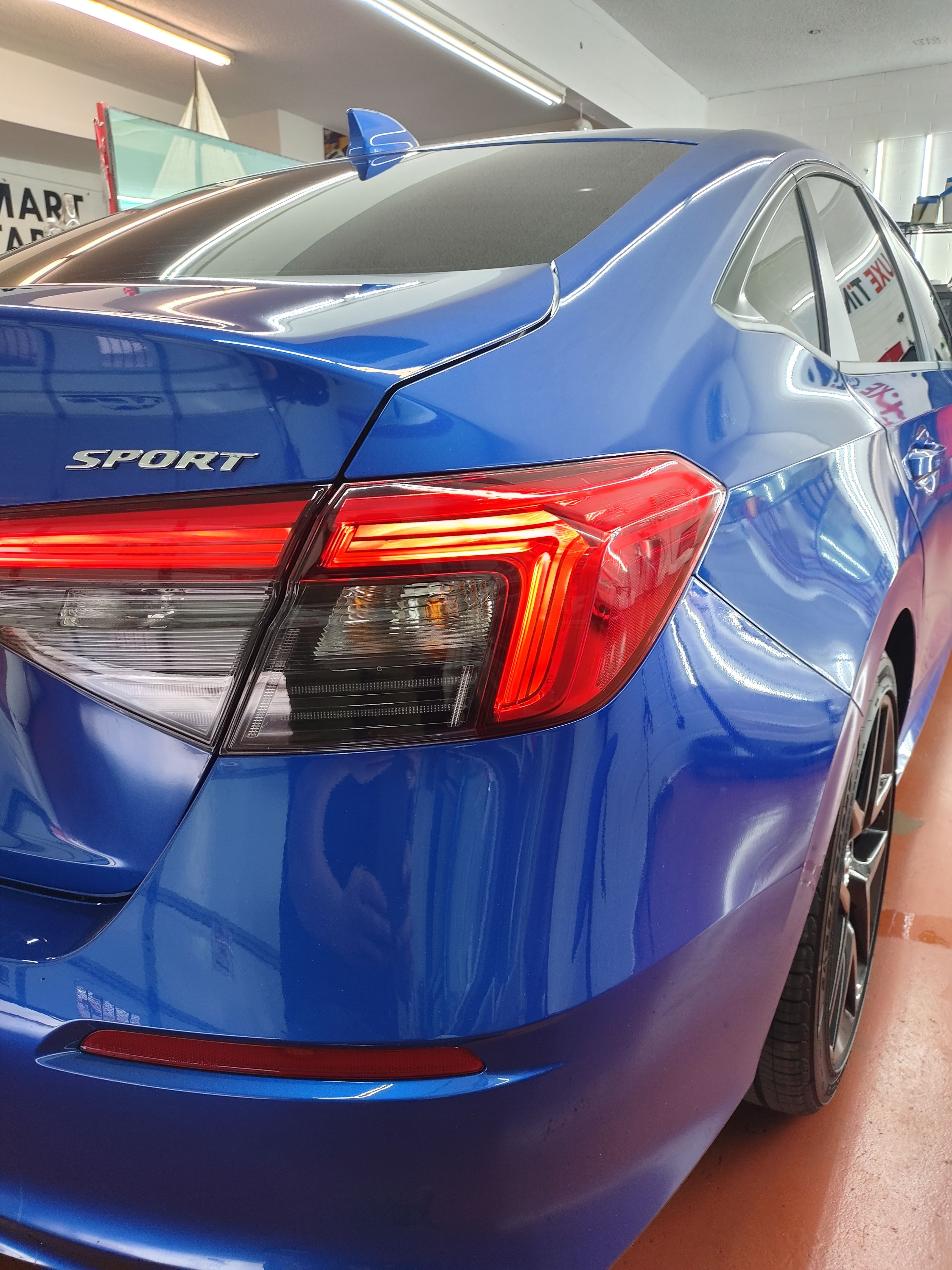 Blue Honda Civic Sport, rear glass