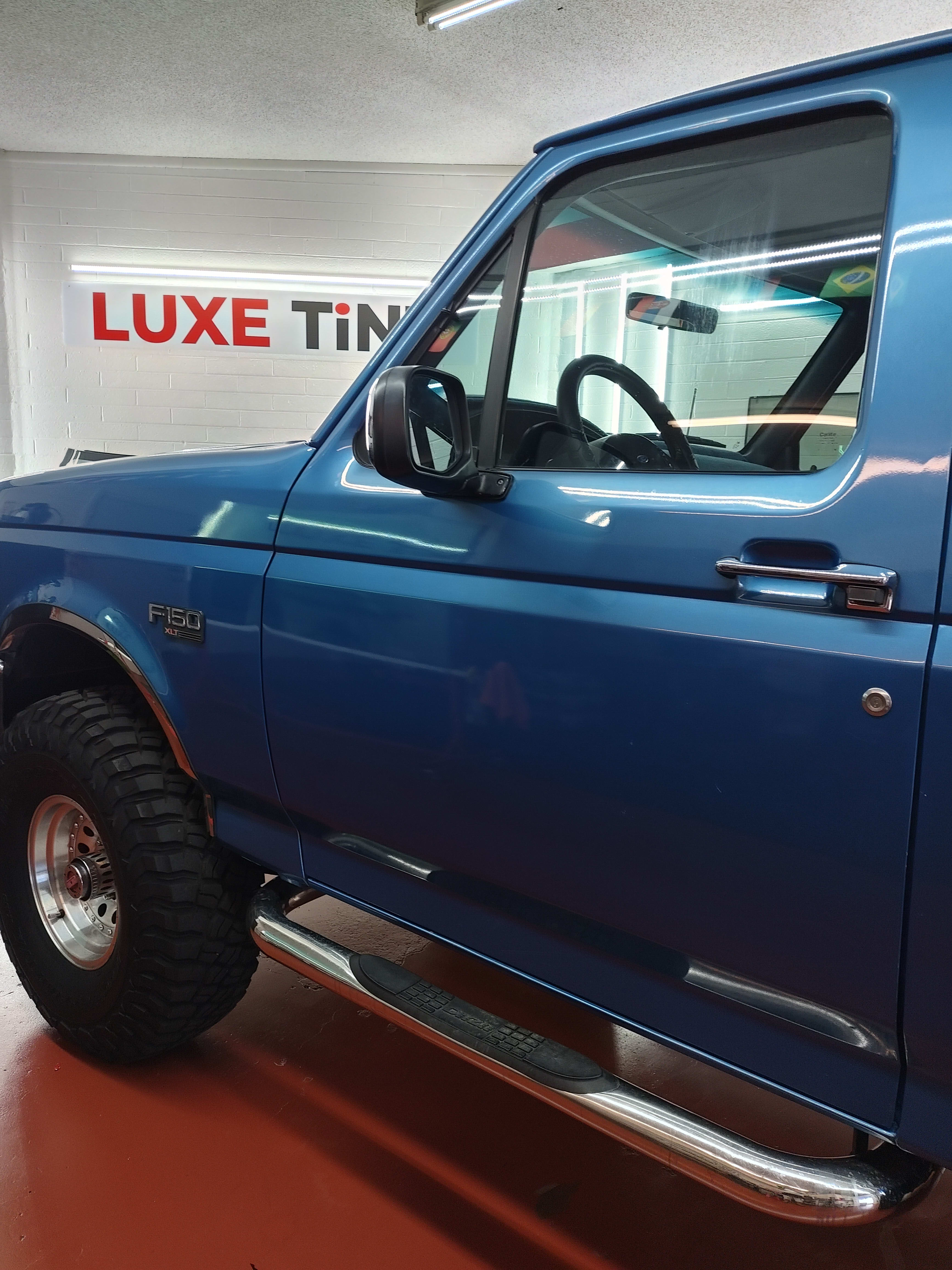 Blue Ford F-150, front three-quarter