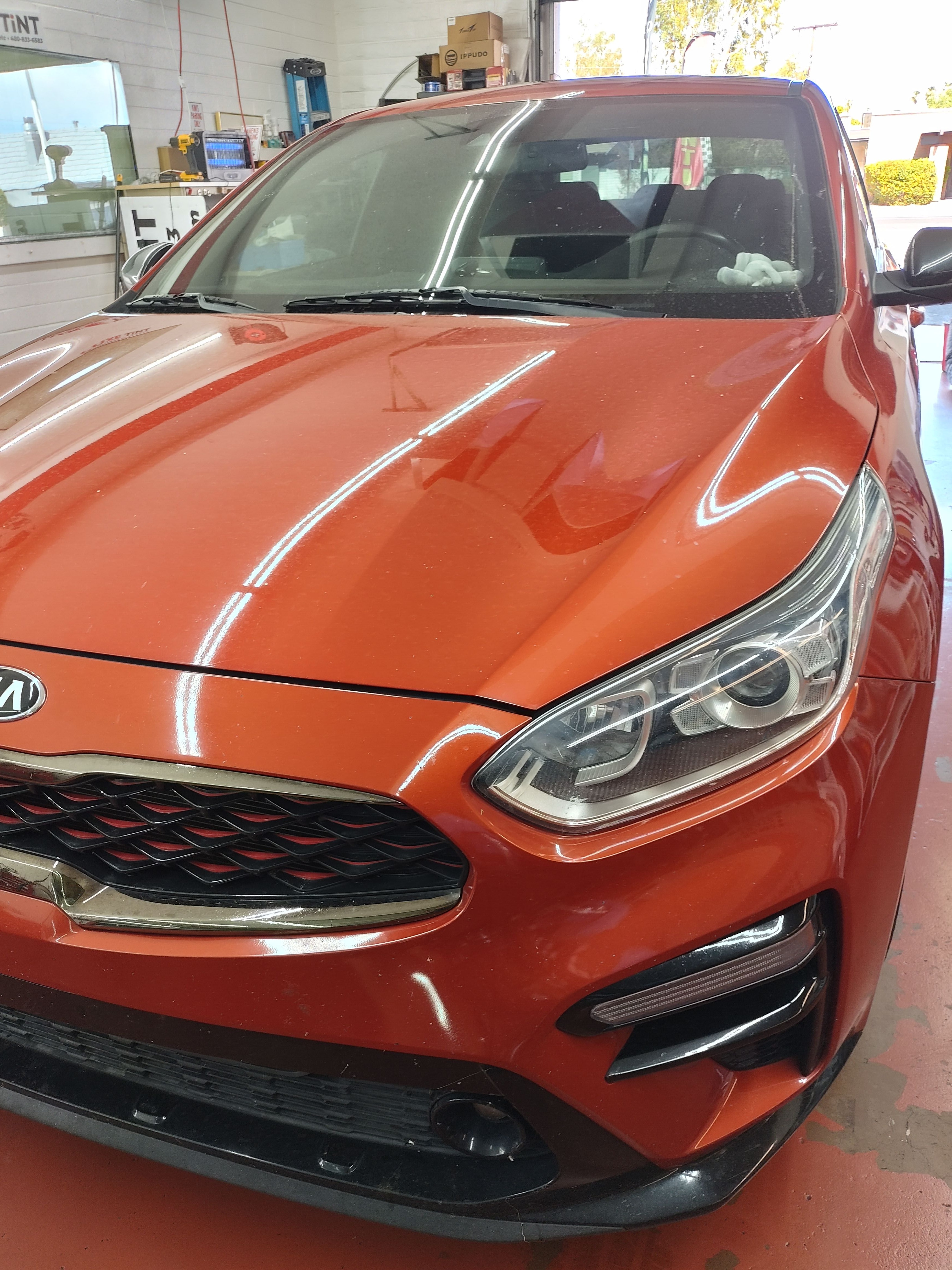 Orange Kia Stinger, front