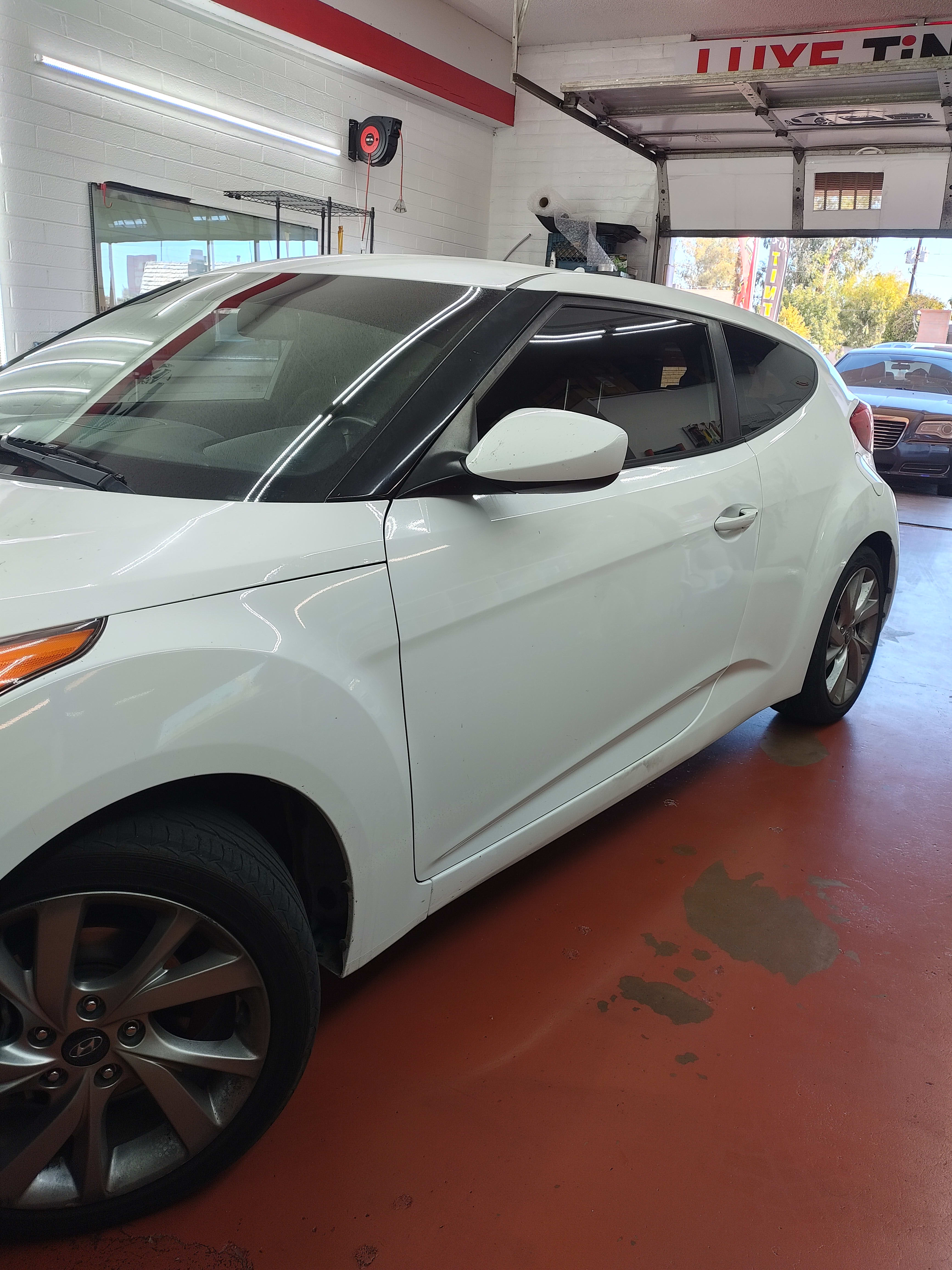 White Hyundai Veloster, front three-quarter