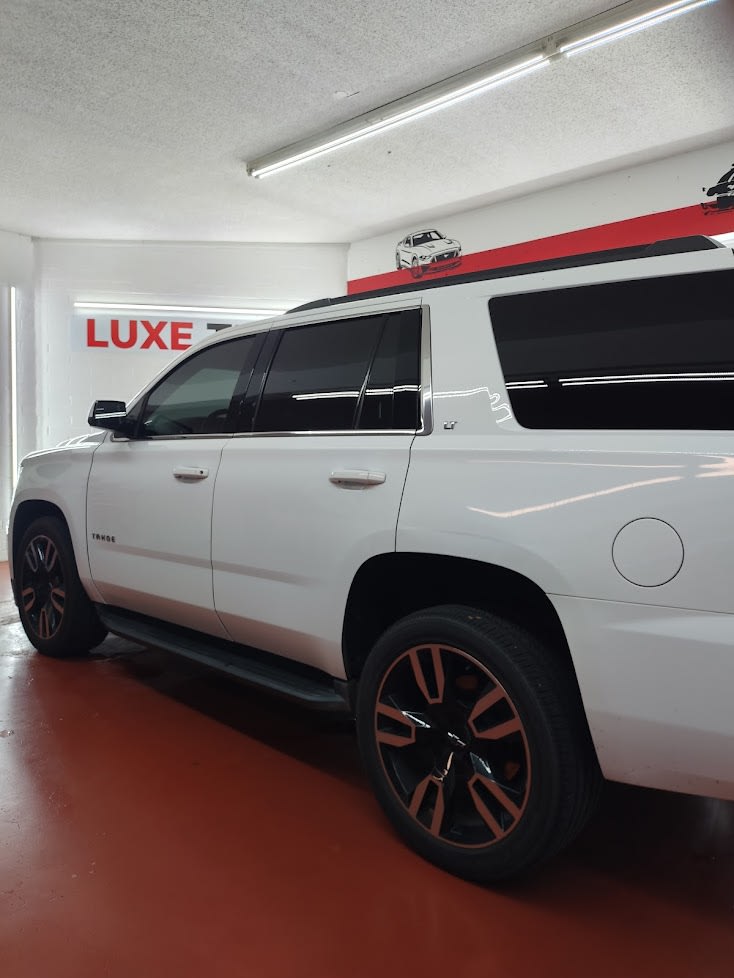 White Chevy Tahoe, side glass