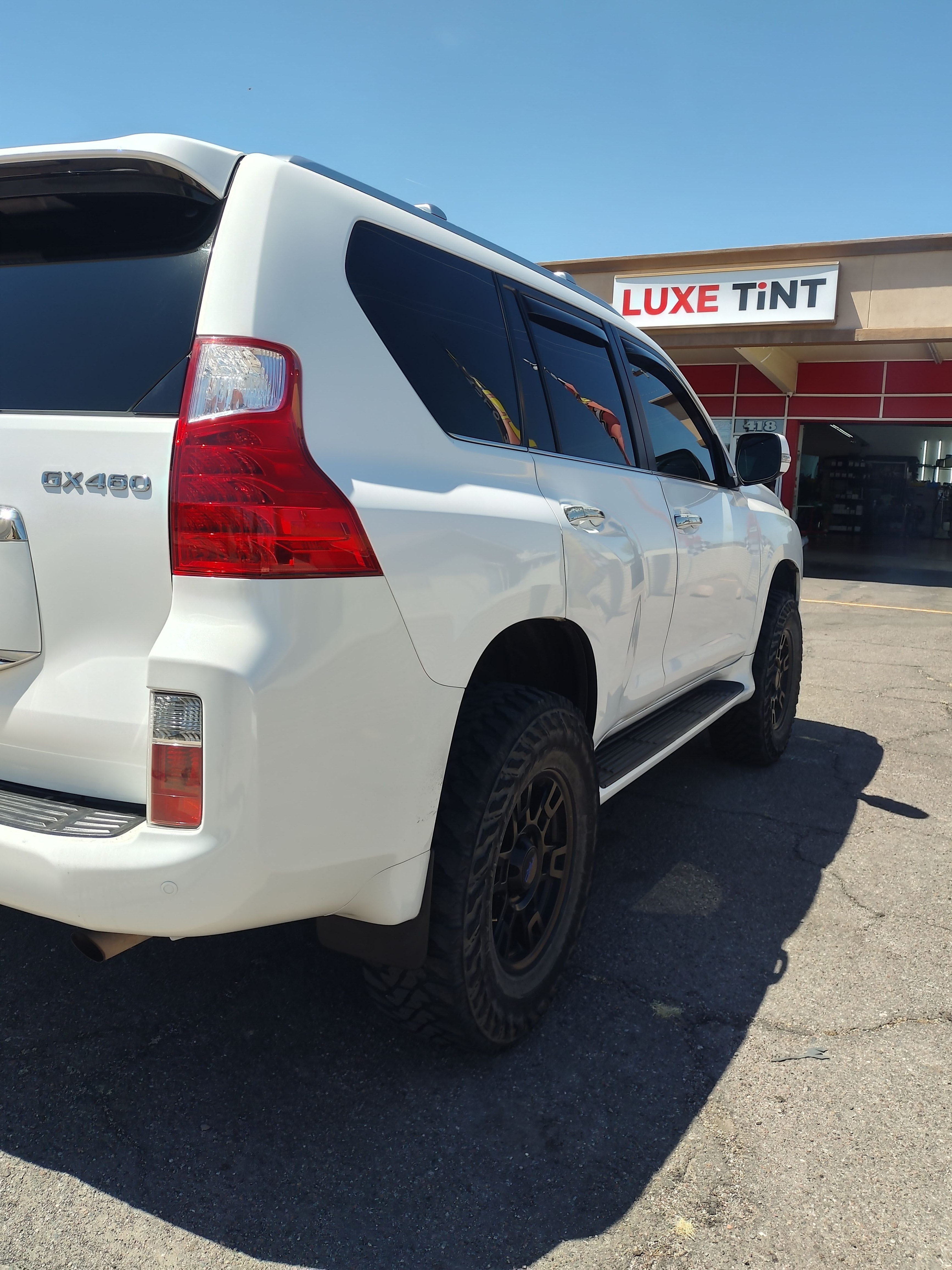 White Lexus GX 460 outside the shop, rear
