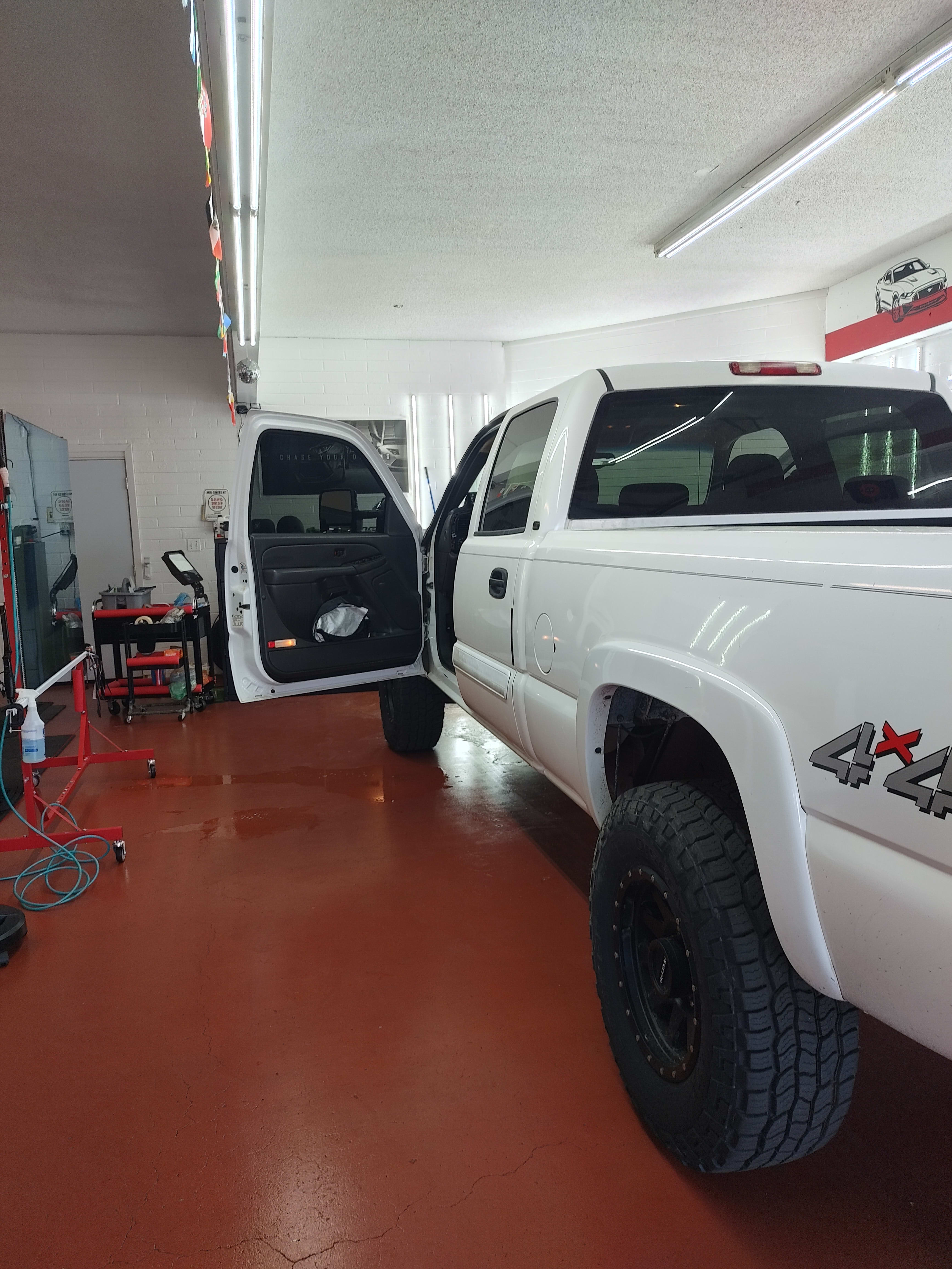 White Chevy Silverado 4x4, rear three-quarter