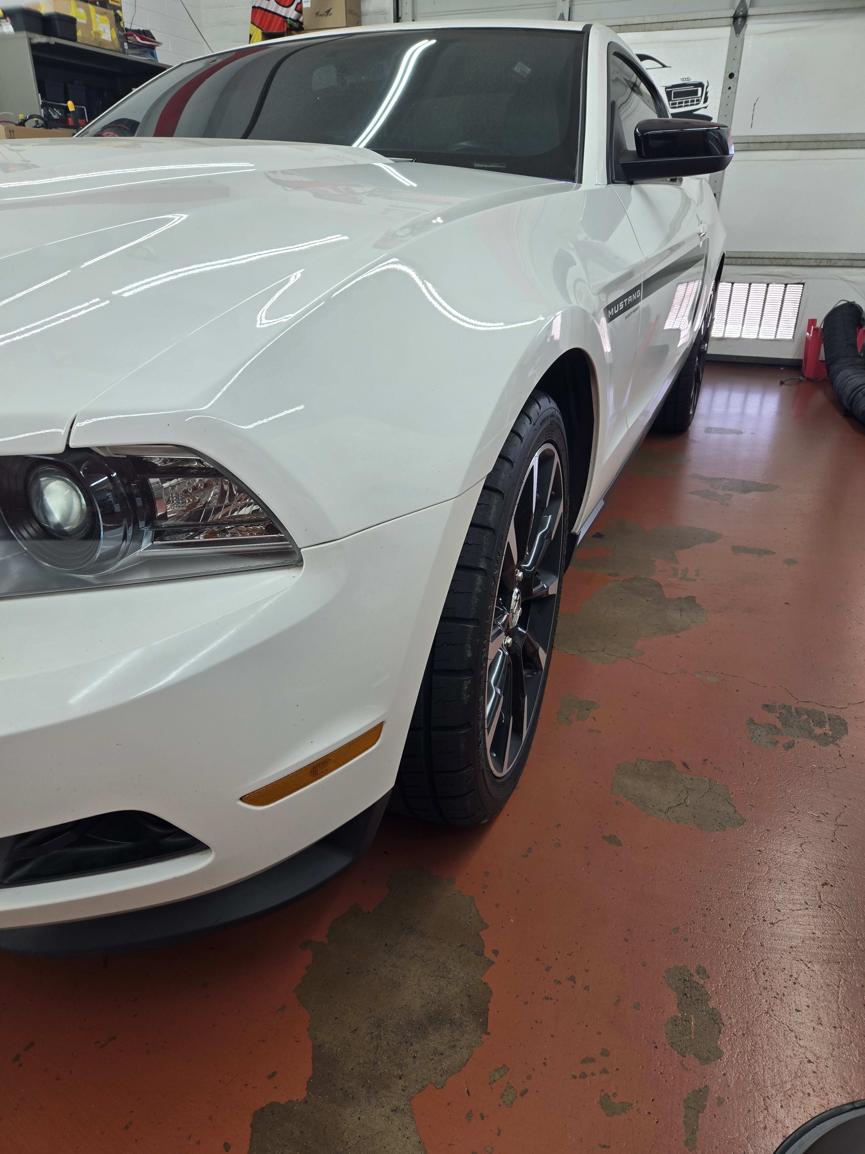 White Ford Mustang, front three-quarter