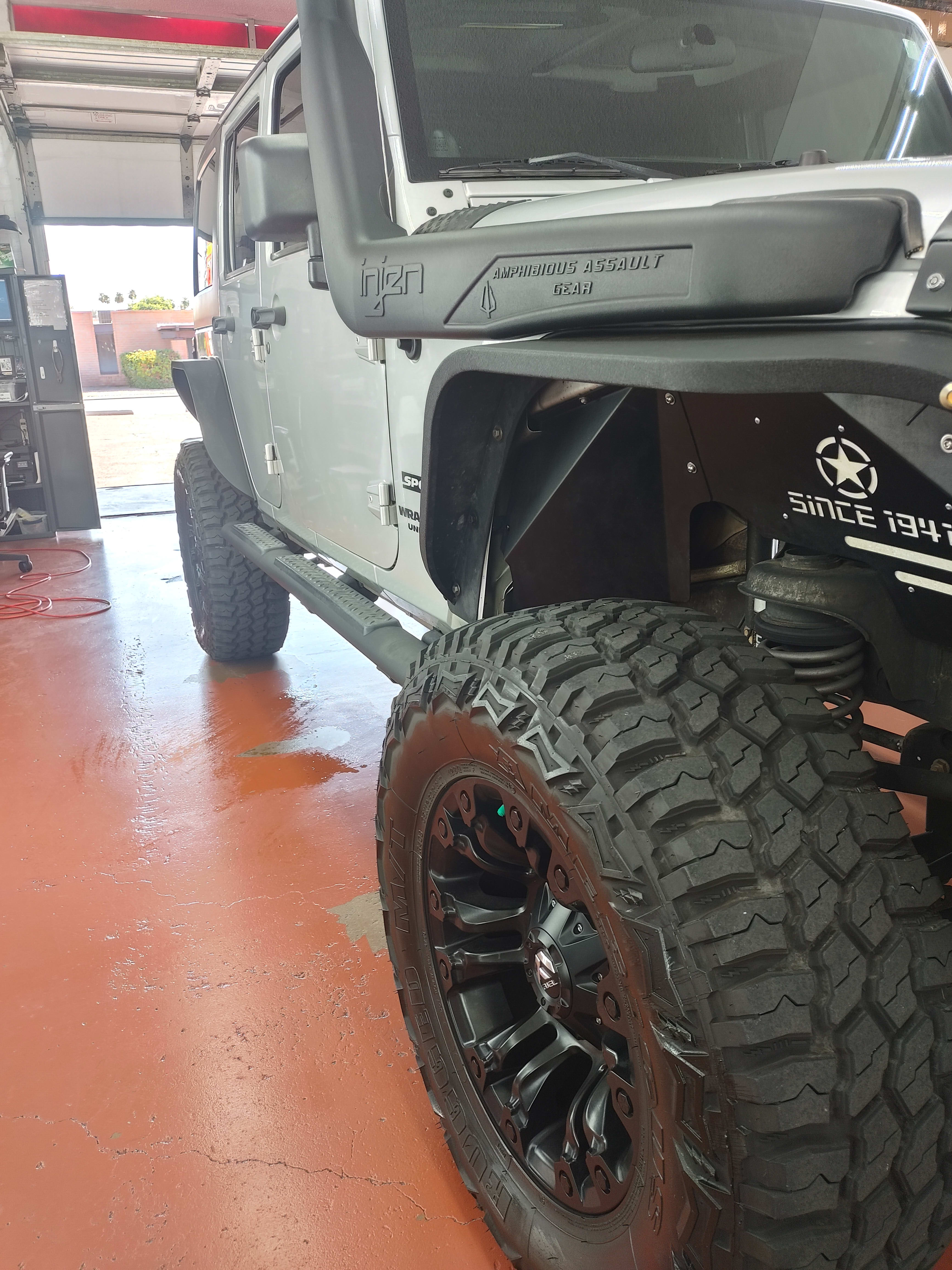 Silver Jeep Wrangler Unlimited, front three-quarter