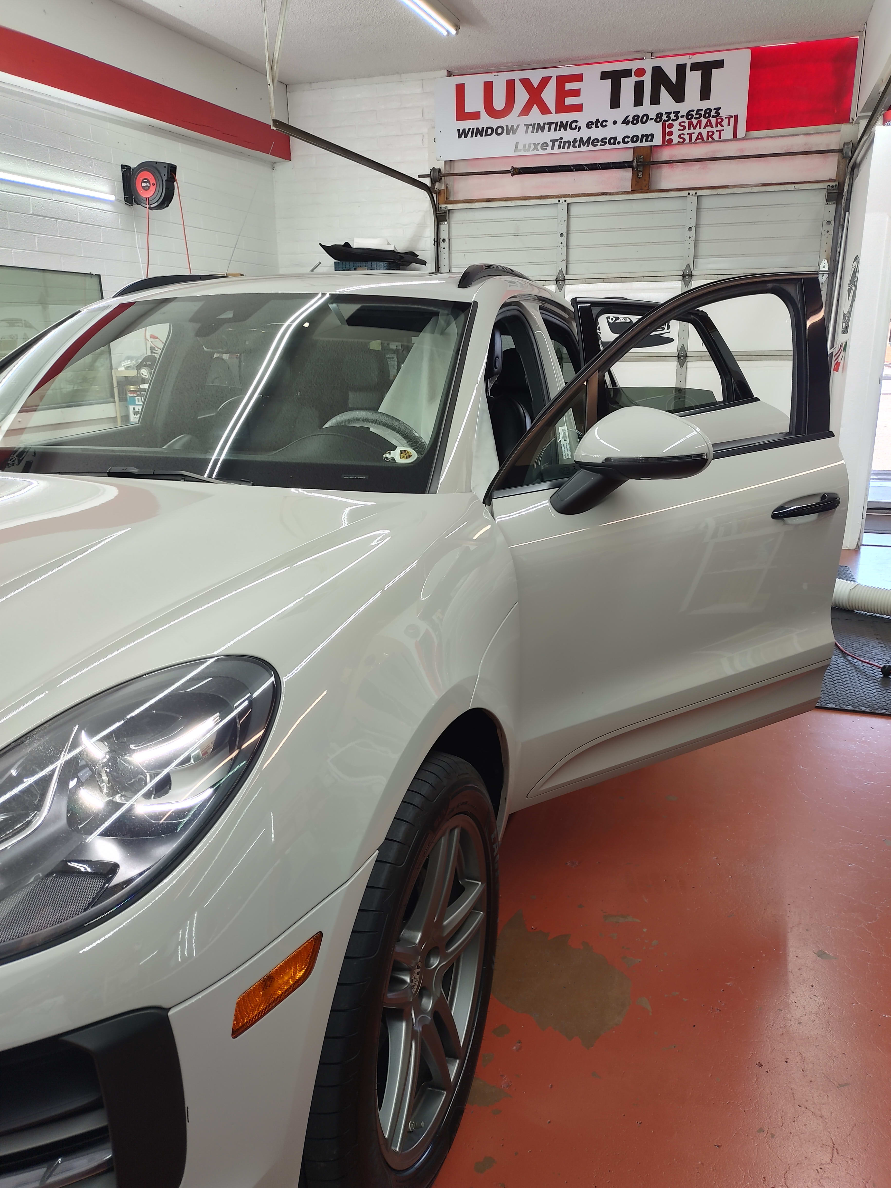 White Porsche Macan, front three-quarter