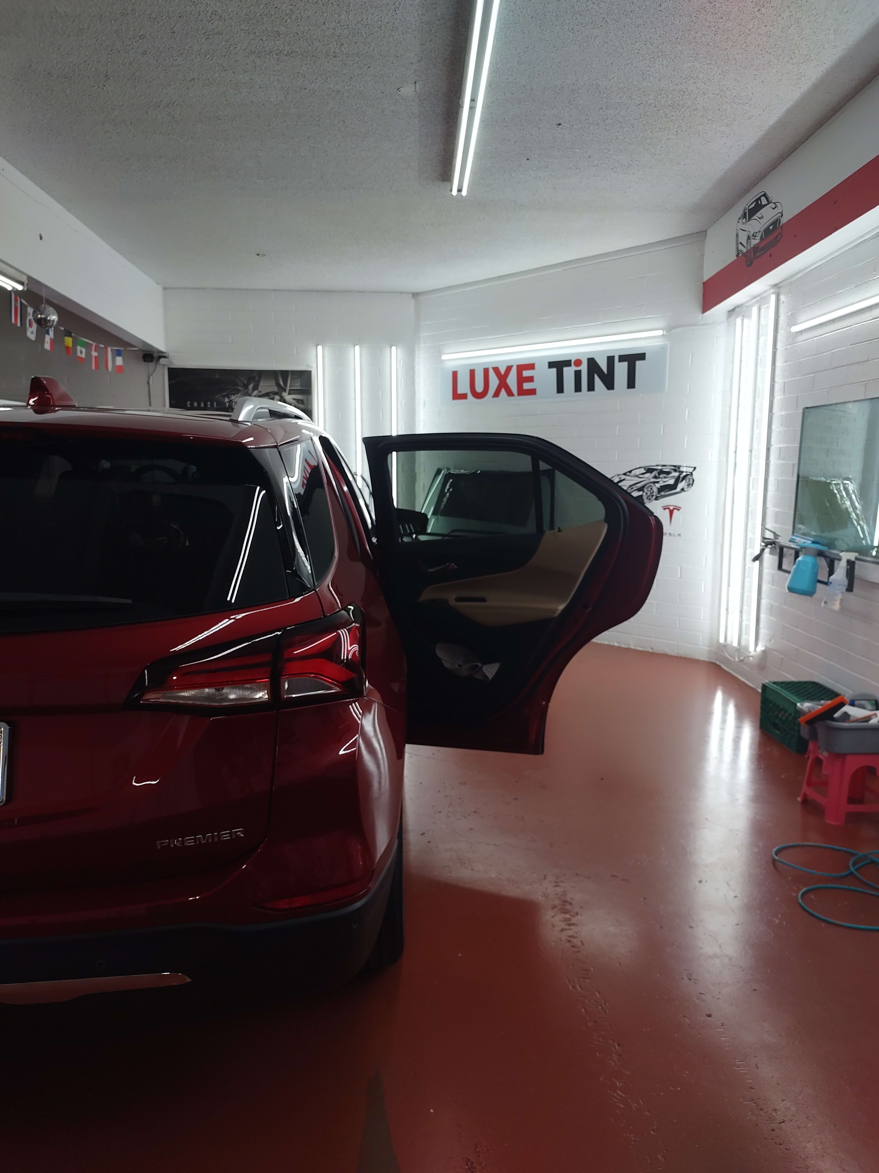 Red Chevy Equinox, rear door open